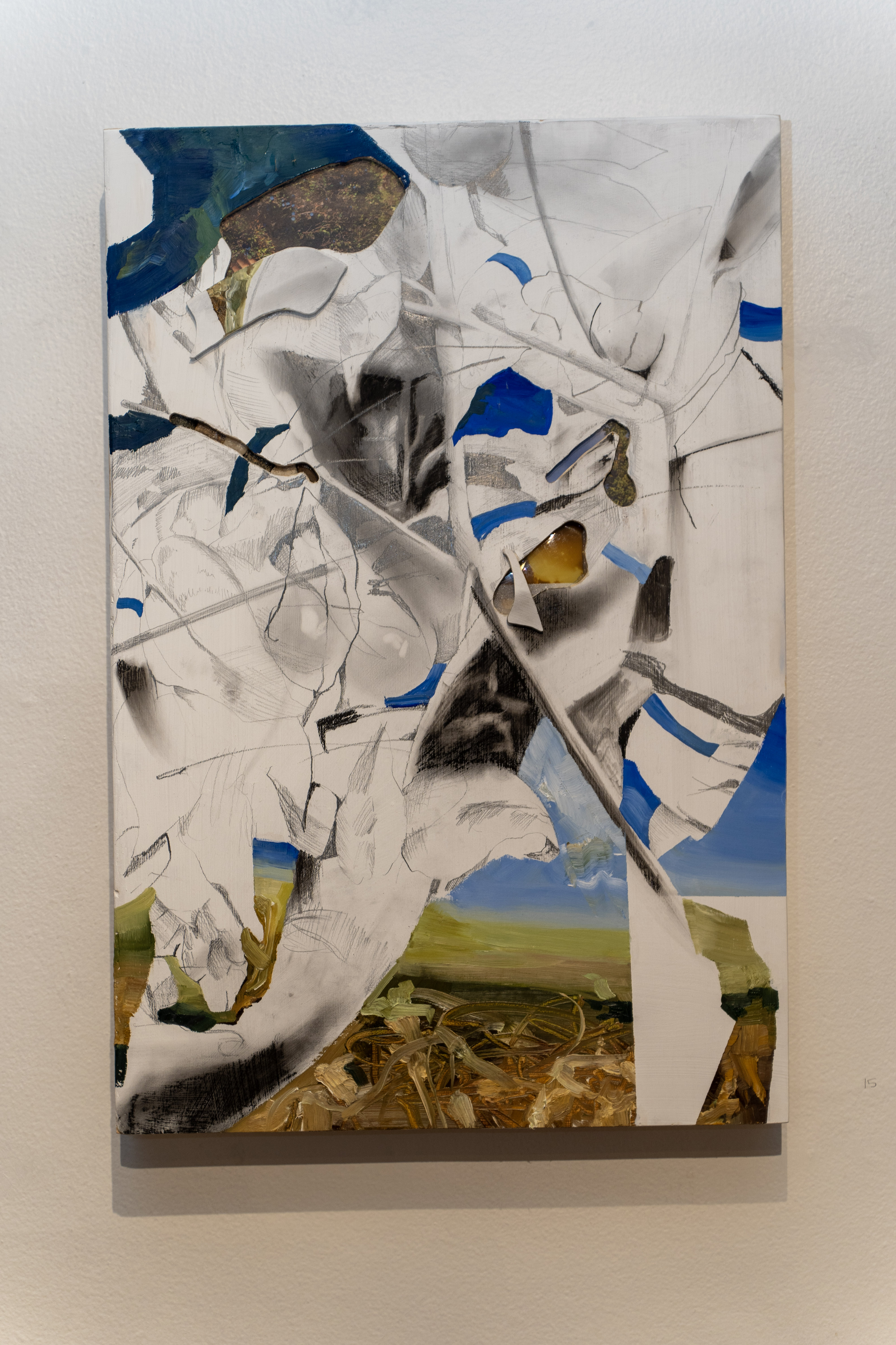 A painting on a panel in shades of white, gray, black, green, brown, and blue hangs on a white wall.