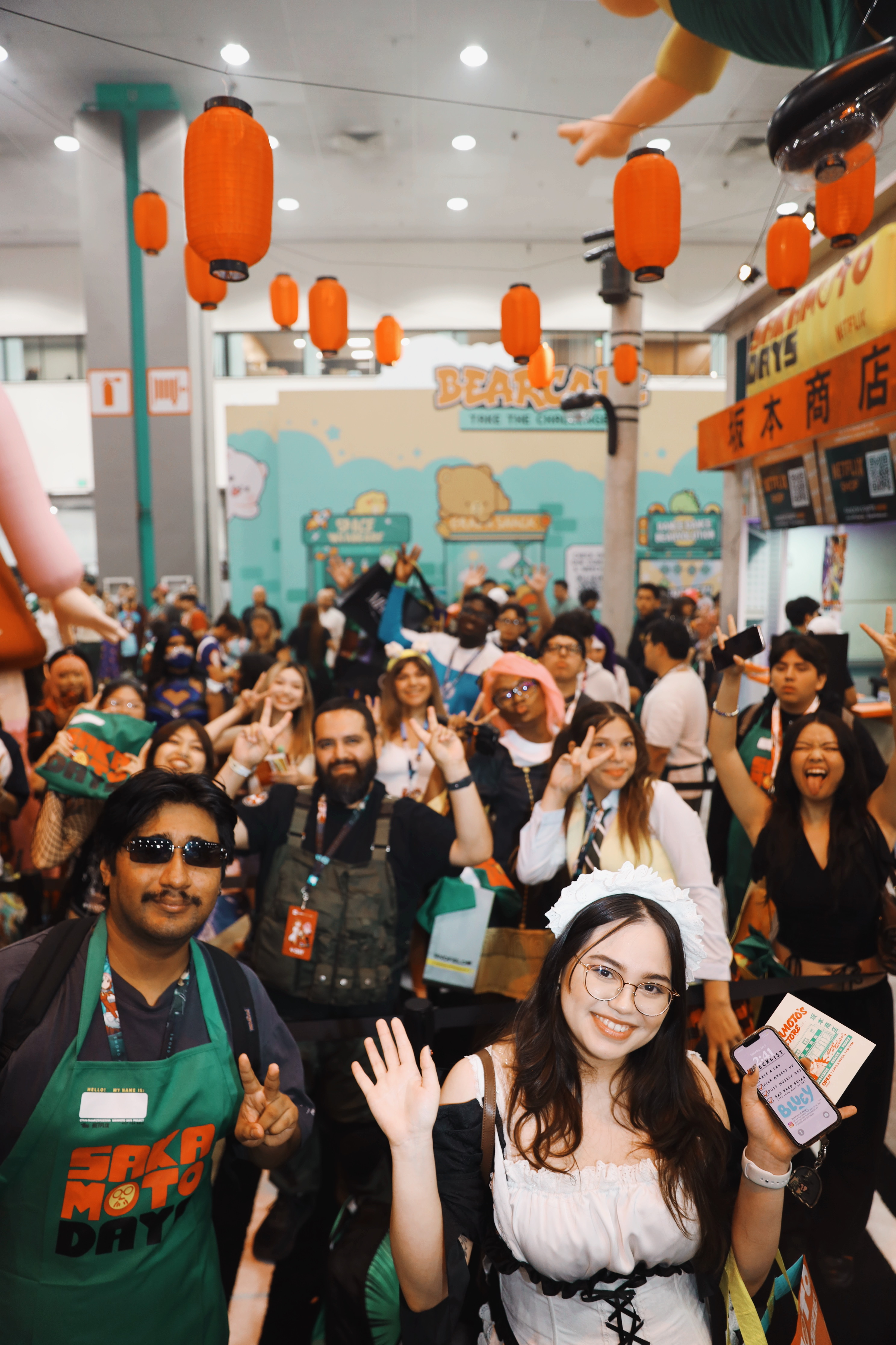 BOOTH ENTRANCE VIEW FROM COURTYARD: Meet and Greets packed the booth every time! Here, people gathered to meet the creators of Sakamoto Days.