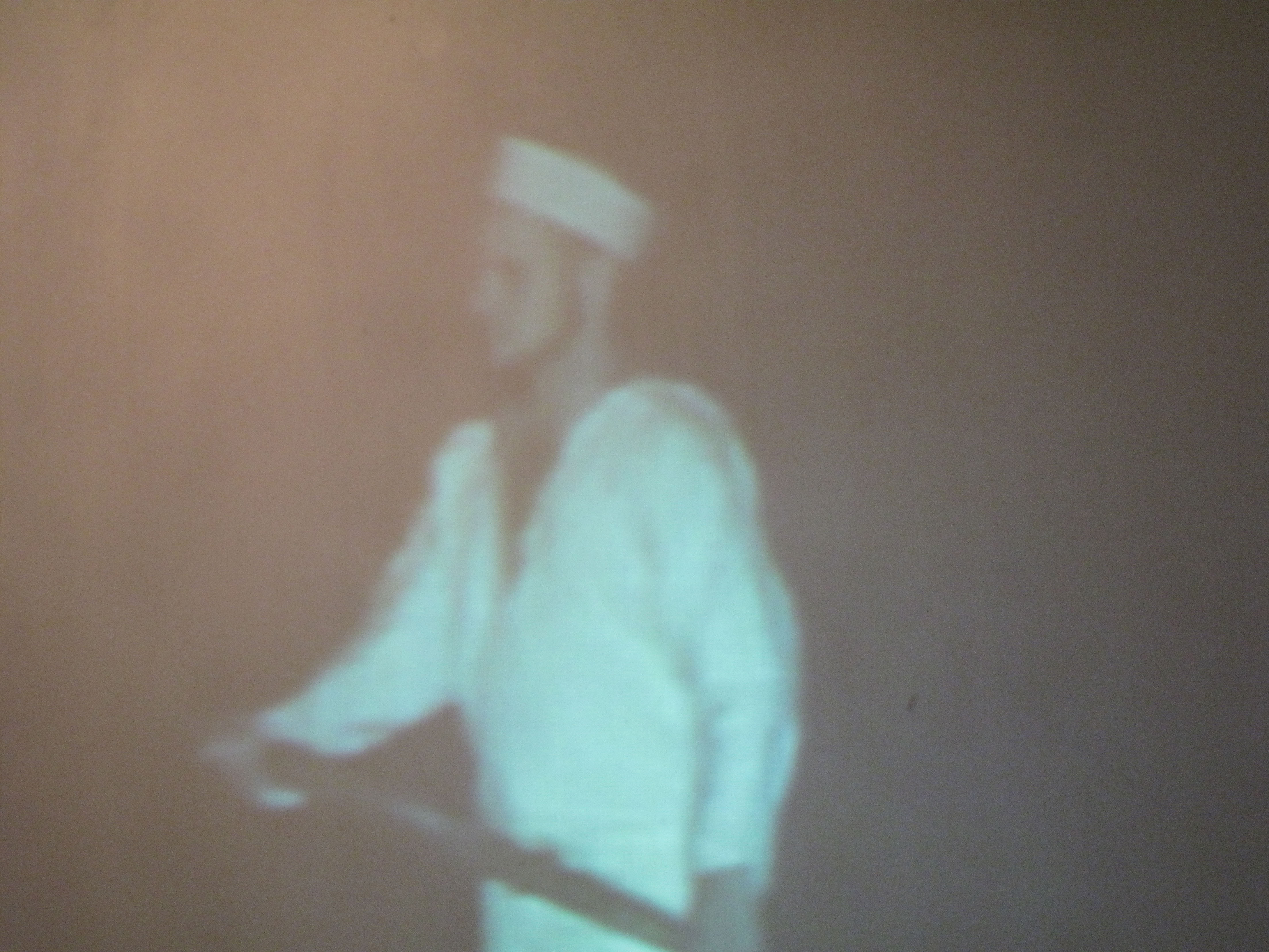 detail view of projected image of rowing sailor in soft focus