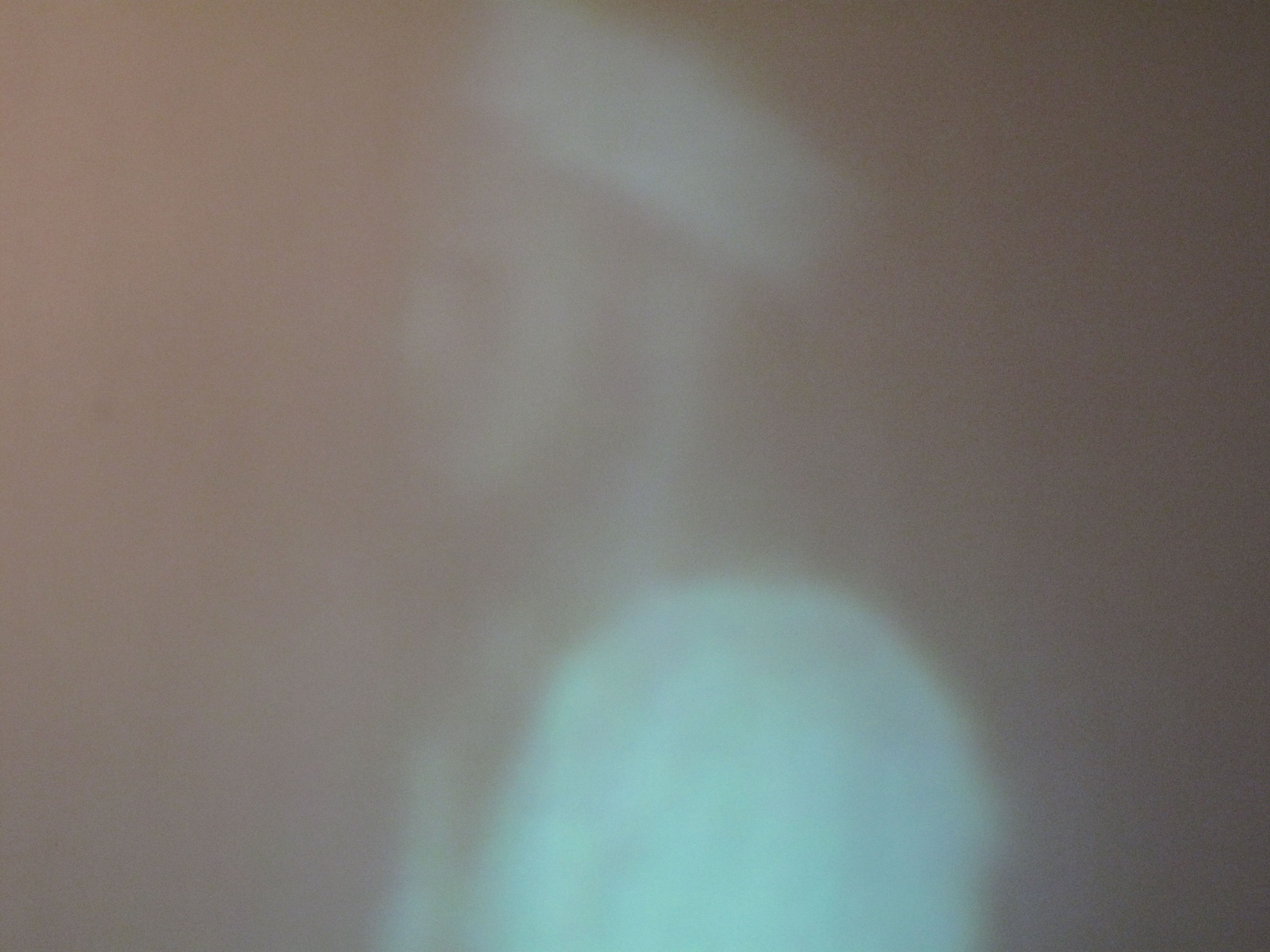 close-up detail view of projected image of sailor dissolving out of focus