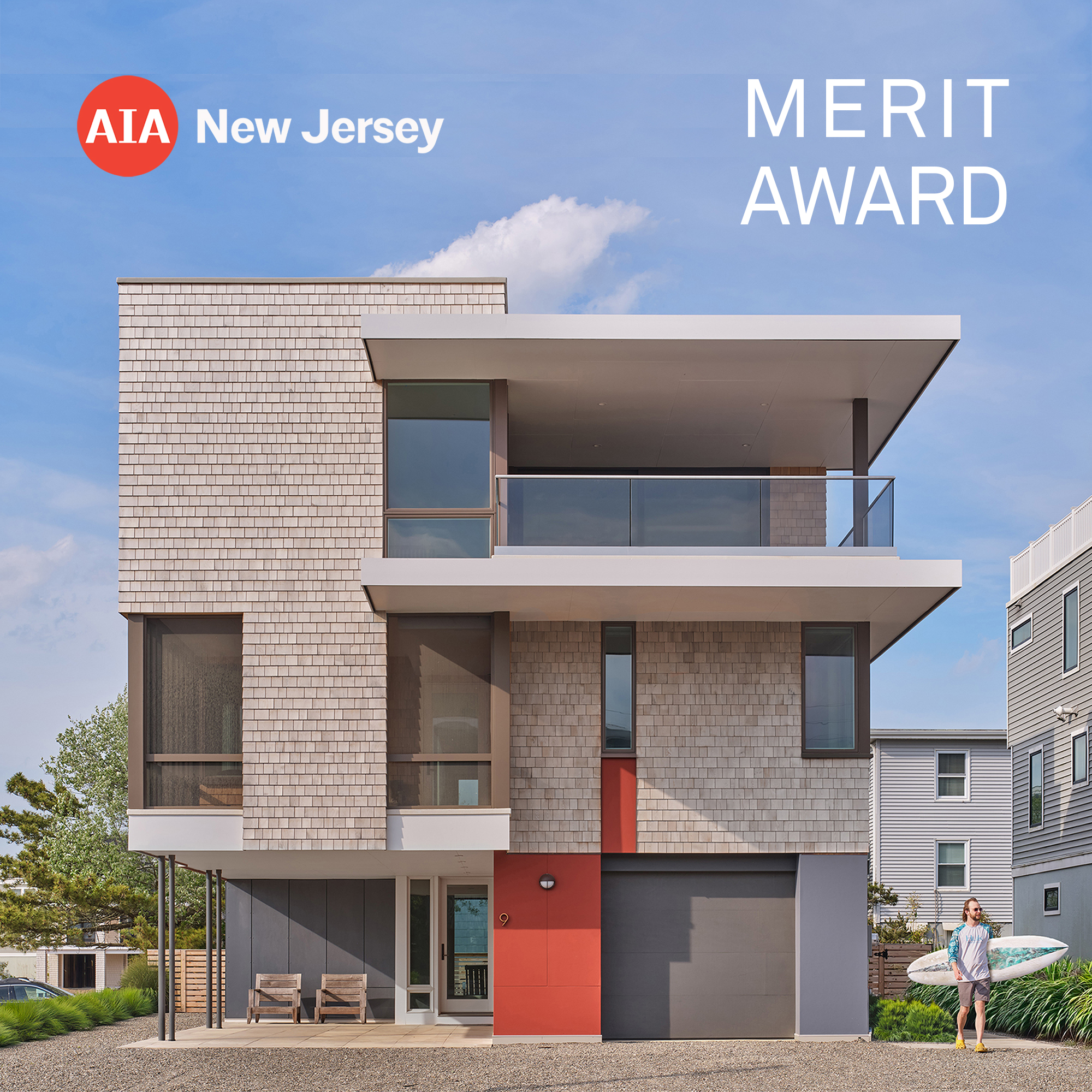 The Gap House exterior photograph, prominently displaying the "AIA New Jersey 2024 Merit Award" graphic, showcasing the modern cedar shingle facade and elevated design.