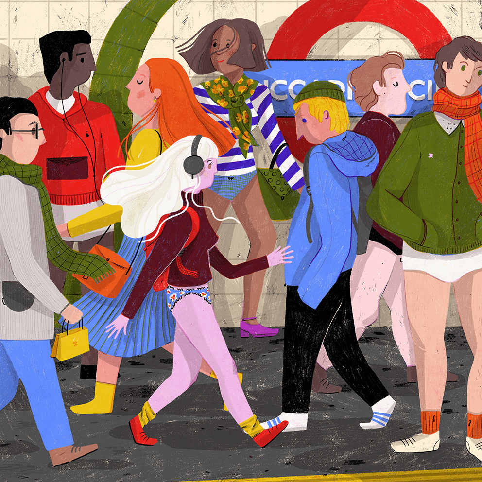 People walking at the Piccadilly circus station.