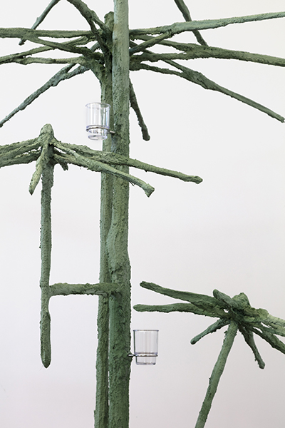 One in the mouth and one in the heart, 2018, umbrellas, steel, plaster, burlap, sand, pigment, cup holders