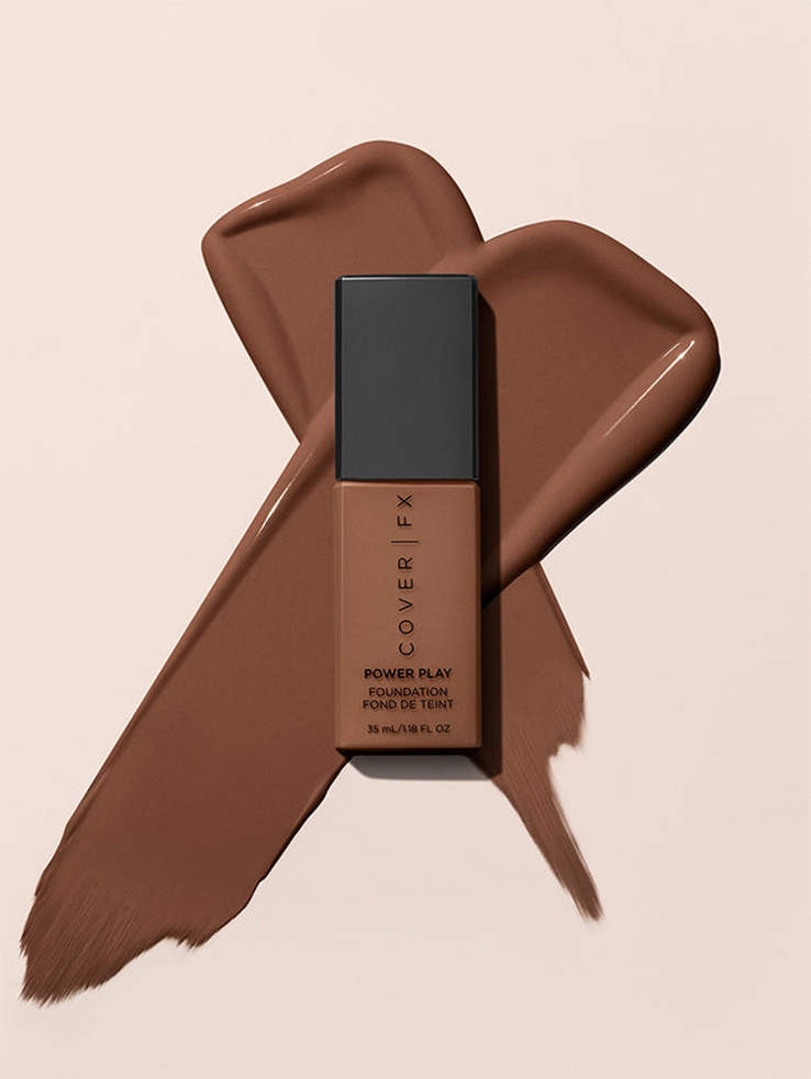 KMA stylist Sara Wacksman designs set for texture photo of Cover FX foundation smeared in the shape of an X under the bottle