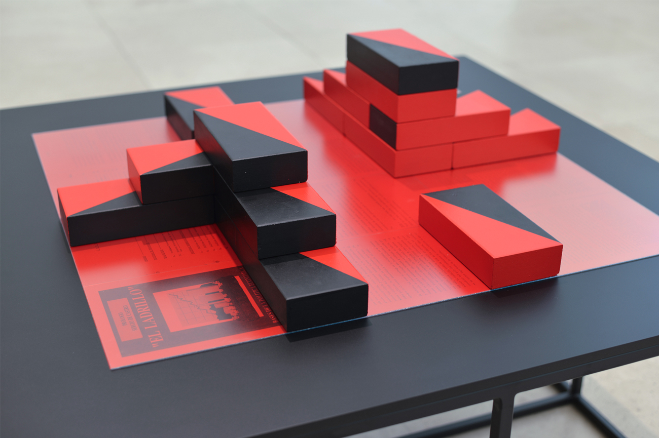 Patrick HamiltonEl Ladrillo, 2019Installation with archives documenting the implementation of the neoliberal model in Chile, front cover, back cover and pages of El Ladrillo. Photocopies, photography (Lambda print), methacrylate, refractory bricks, acrylic paint, MDF boards and metal base82 x 100 x 100 cm