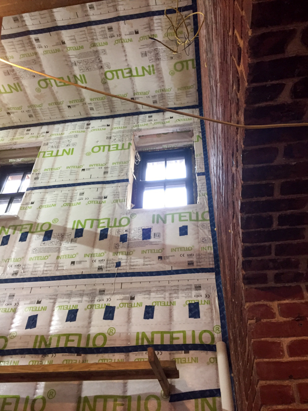 Additional insulating and vapor control at interior during construction
