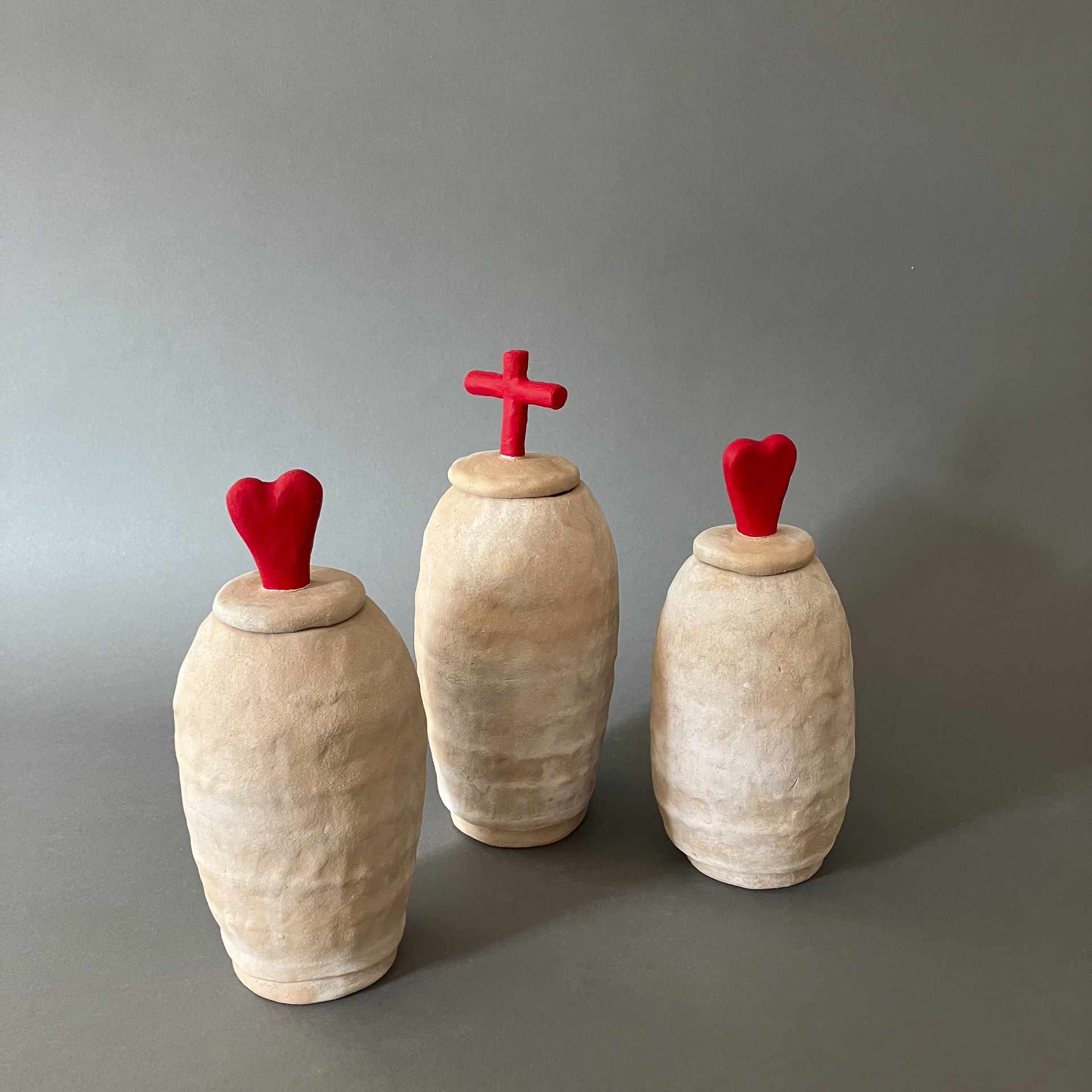 Deborah Baker "Red Heart Urns" and "Red Cross Urn"