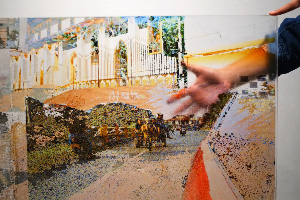 Detail shot (top left corner with hand behind PlexiGlass)