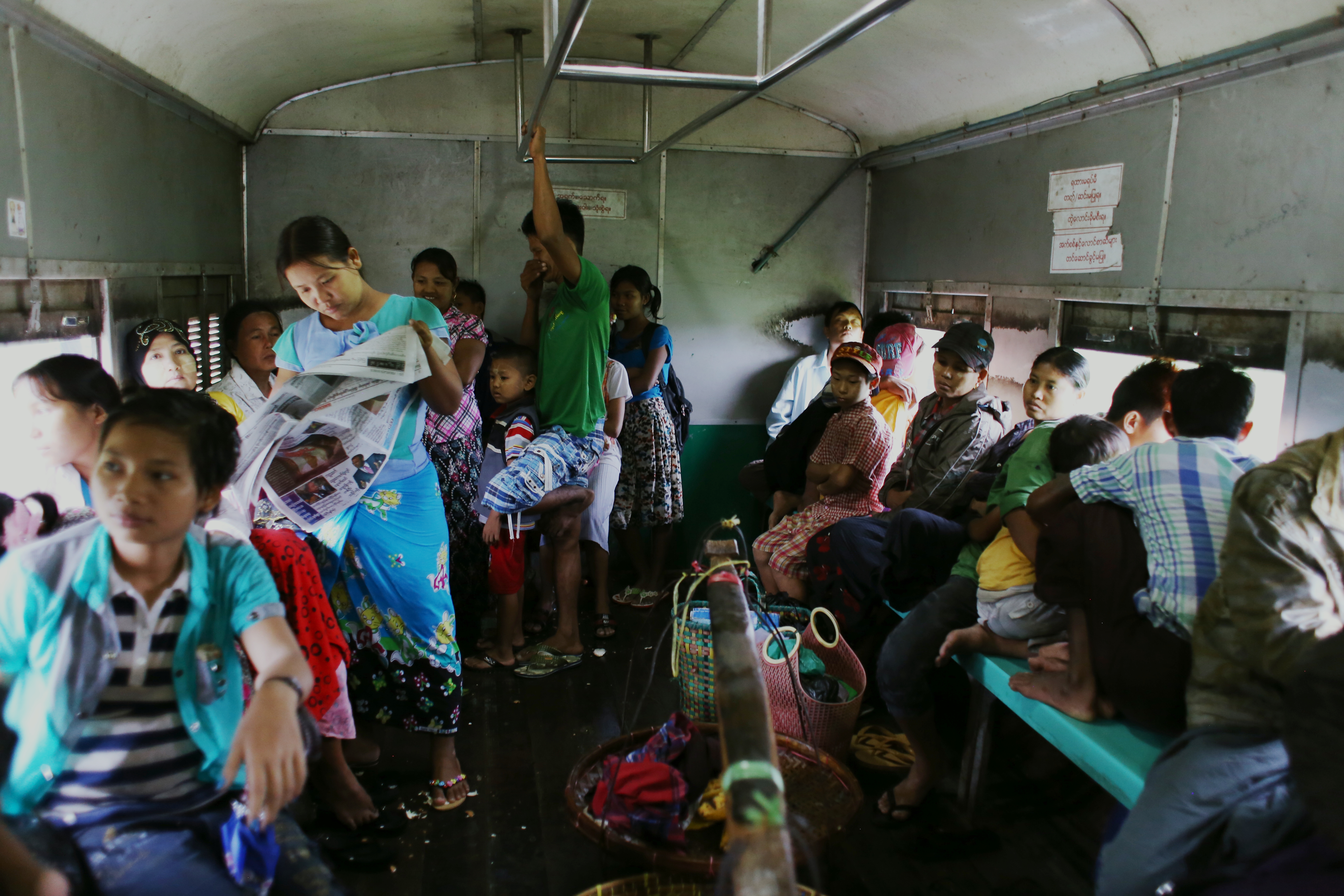The Yangon Circular Railway takes three hours to loop around the city. It’s a muggy 30-degree day when I purchase my ticket, and an attendant excitedly tells me that the carriages are air-conditioned. I find out later that this is in the form of open windows and spluttering, tired roof fans that do nothing more than add to the cacophony. A policeman half-heartedly taps one of the fans with his baton each time it drifts to a halt.