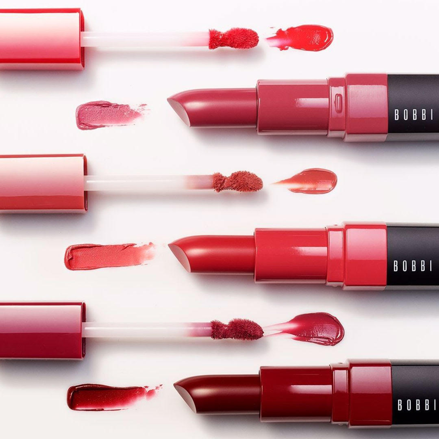 KMA photographer Vincent Gapaillard photographs several shades of Bobbi Brown lip gloss smeared on a white surface 