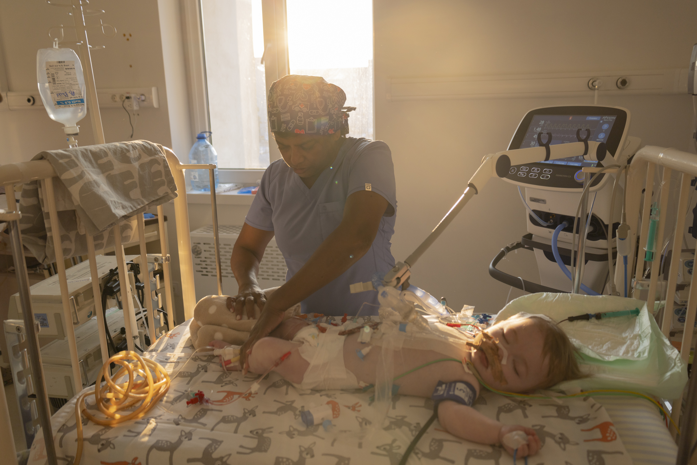 Nurse Lutchmee Kisten watches over a one-year-old patient in the intensive care unit.
