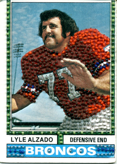 Here's Past (Lyle Alzado). Beads on trading card.  3 1/2" x 2 1/2". 1995-97.