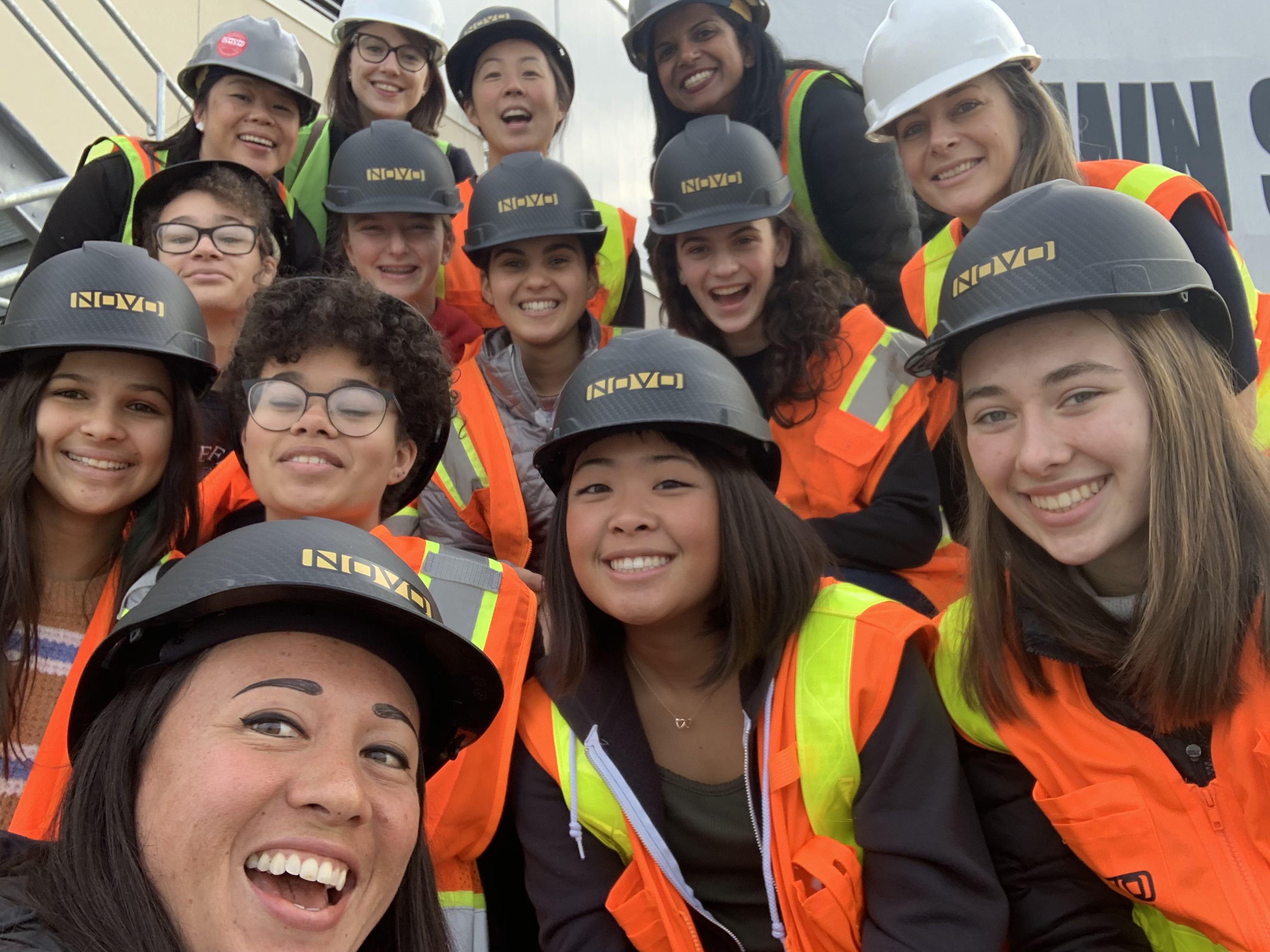 High school students from Girls Garage visit a local construction site with NOVO Construction.