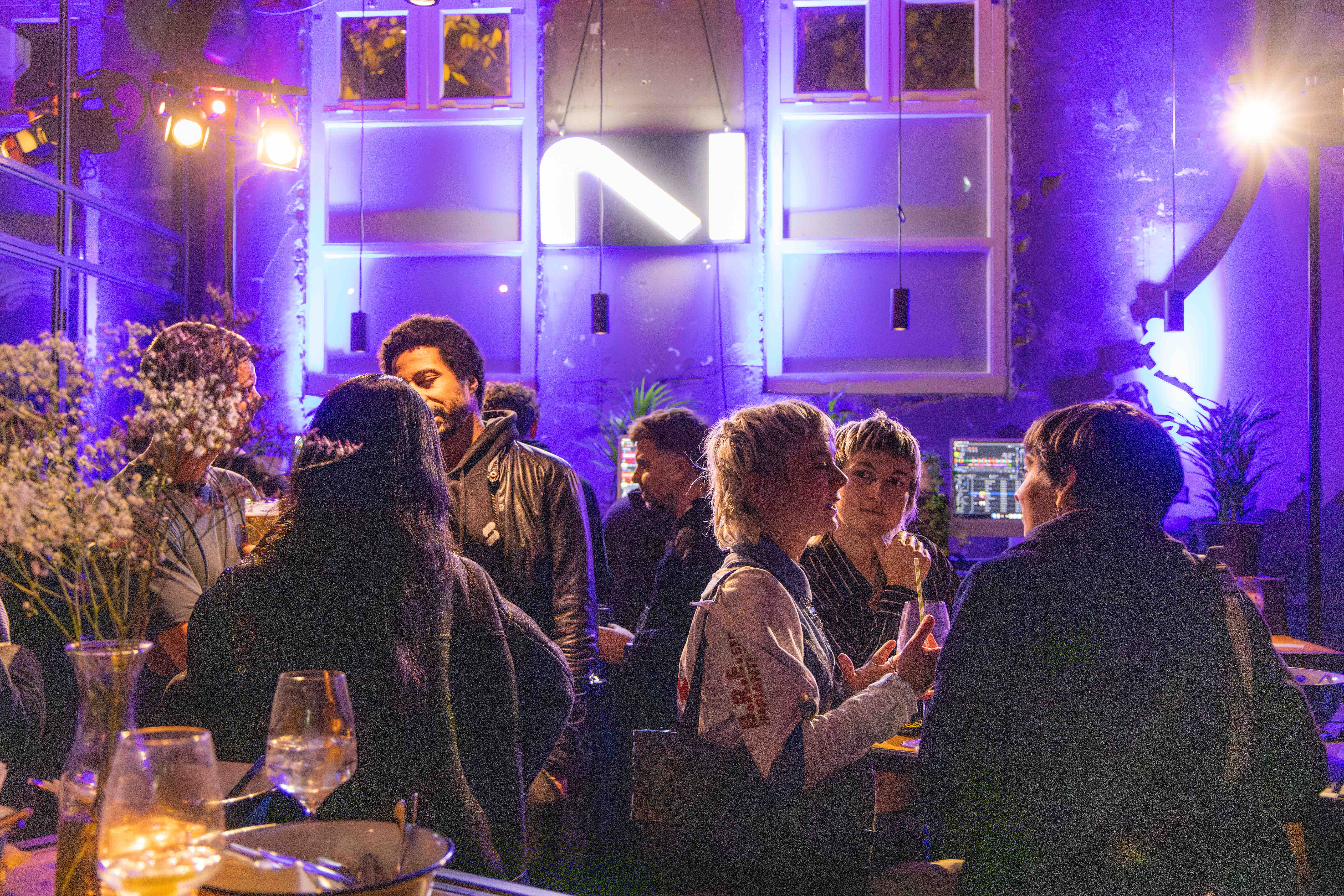 Guests chatting during the Native Instruments industry mixer at ADE 2025.