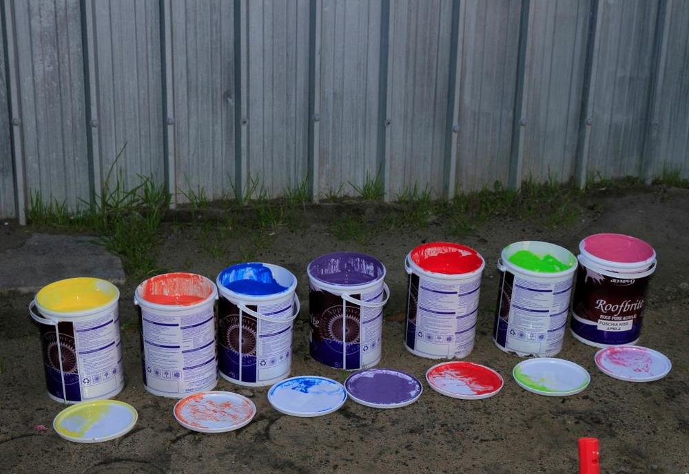 Painting the Empower Shack prototype with Phumezo's family to promote the project