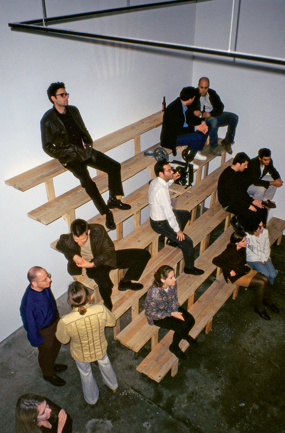 Projector Stand #3, 1995&ndash;96. Five photographs, two 16mm films, projector, projector stand, union projectionist. Dimensions variable