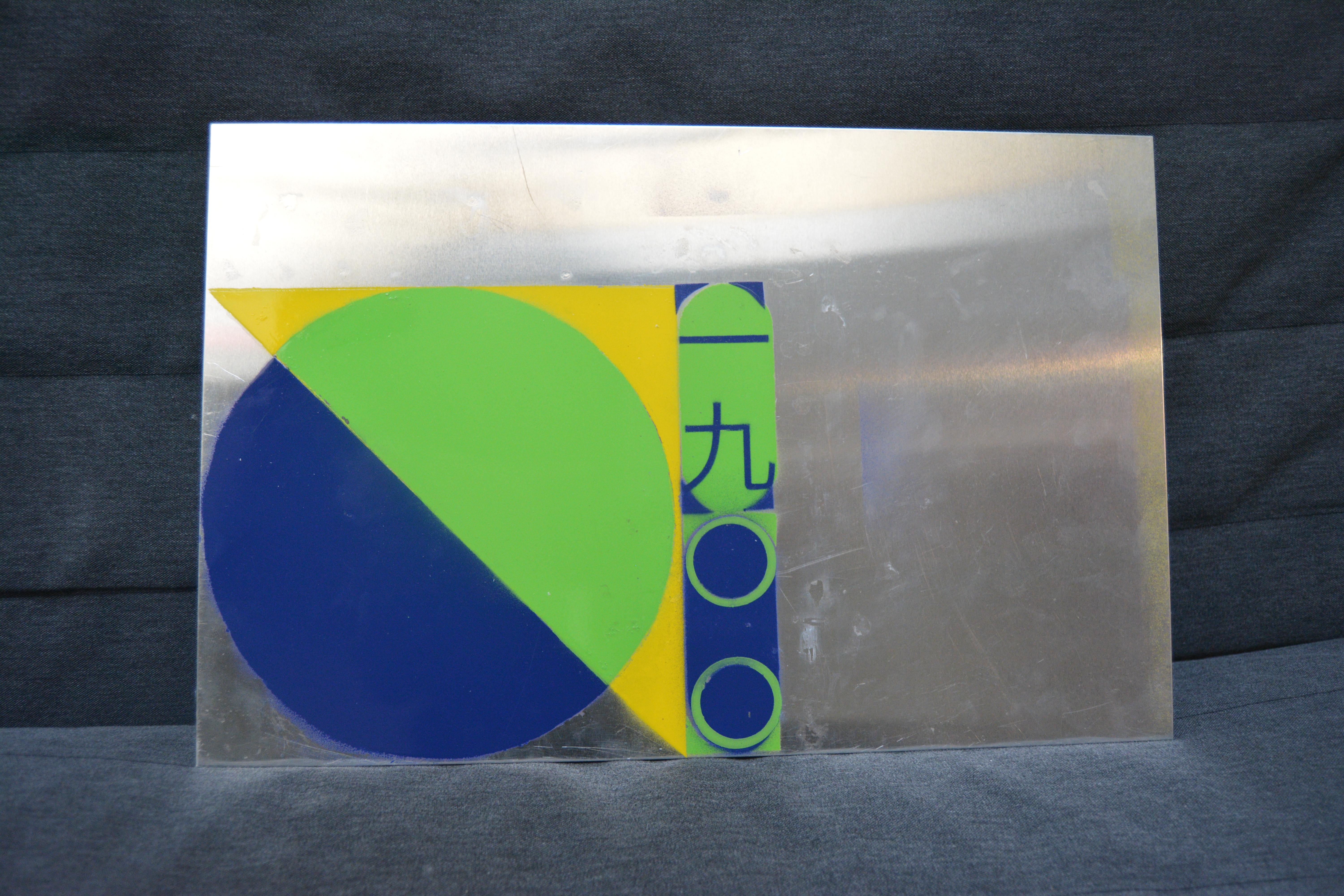 First spray painted design on metal plate