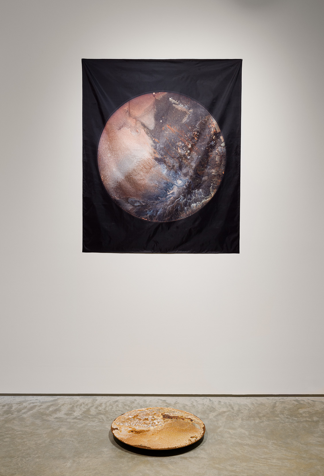 (Top) Mary Mattingly, "Salt Moon King Tide," 2023. Dye sublimation on translucent fabric, 58 x 48 inches. (Bottom) Mary Mattingly, "Salt Moon Neap Tide," 2023. Salt disc, 24 inches in diameter. Photo by Etienne Frossard.  