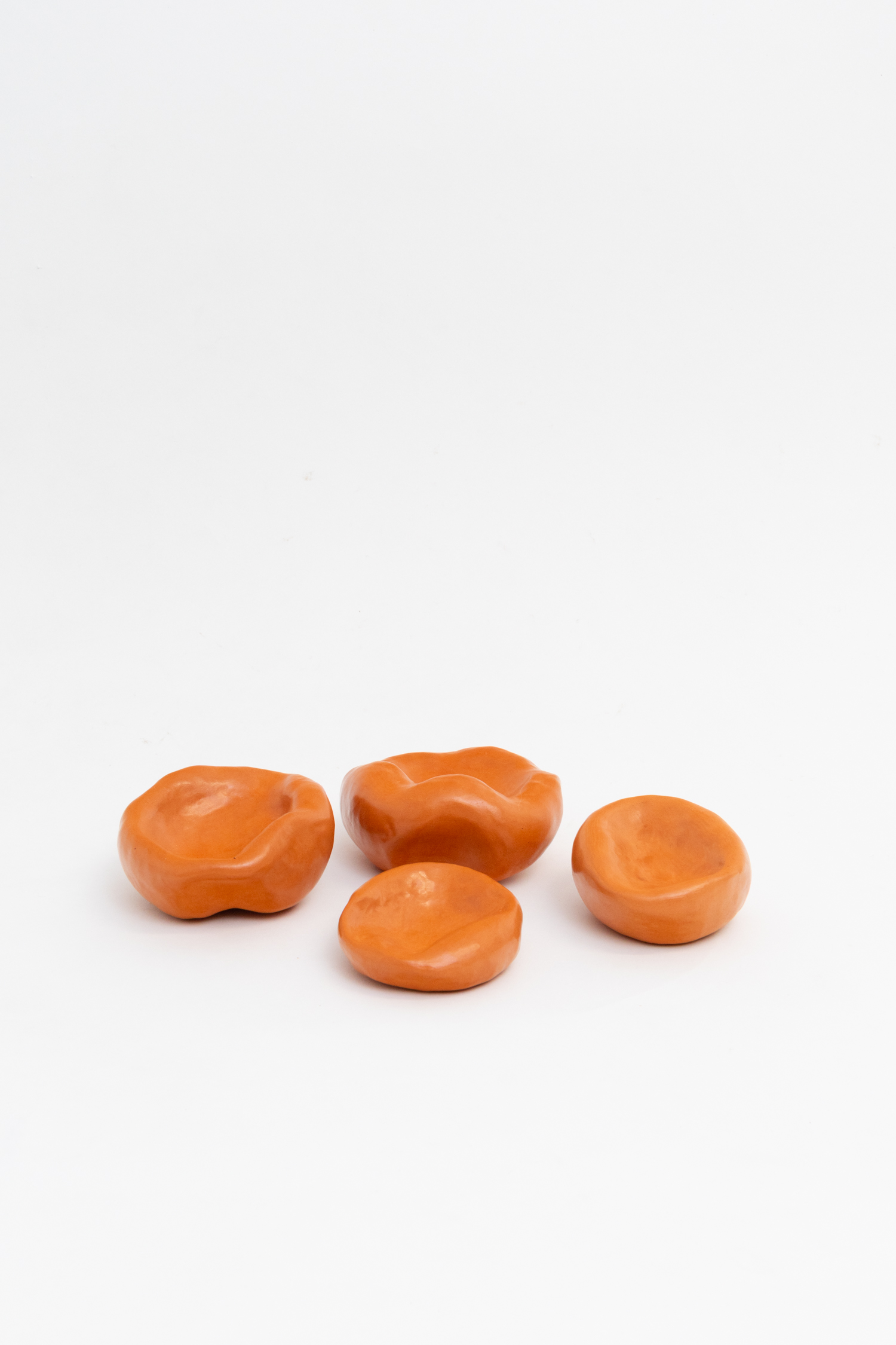 Nicholas Smith, Ashtrays (IV - VIII), 2025, Burnished terracotta, beeswax, 15 x 15 x 10 cm each