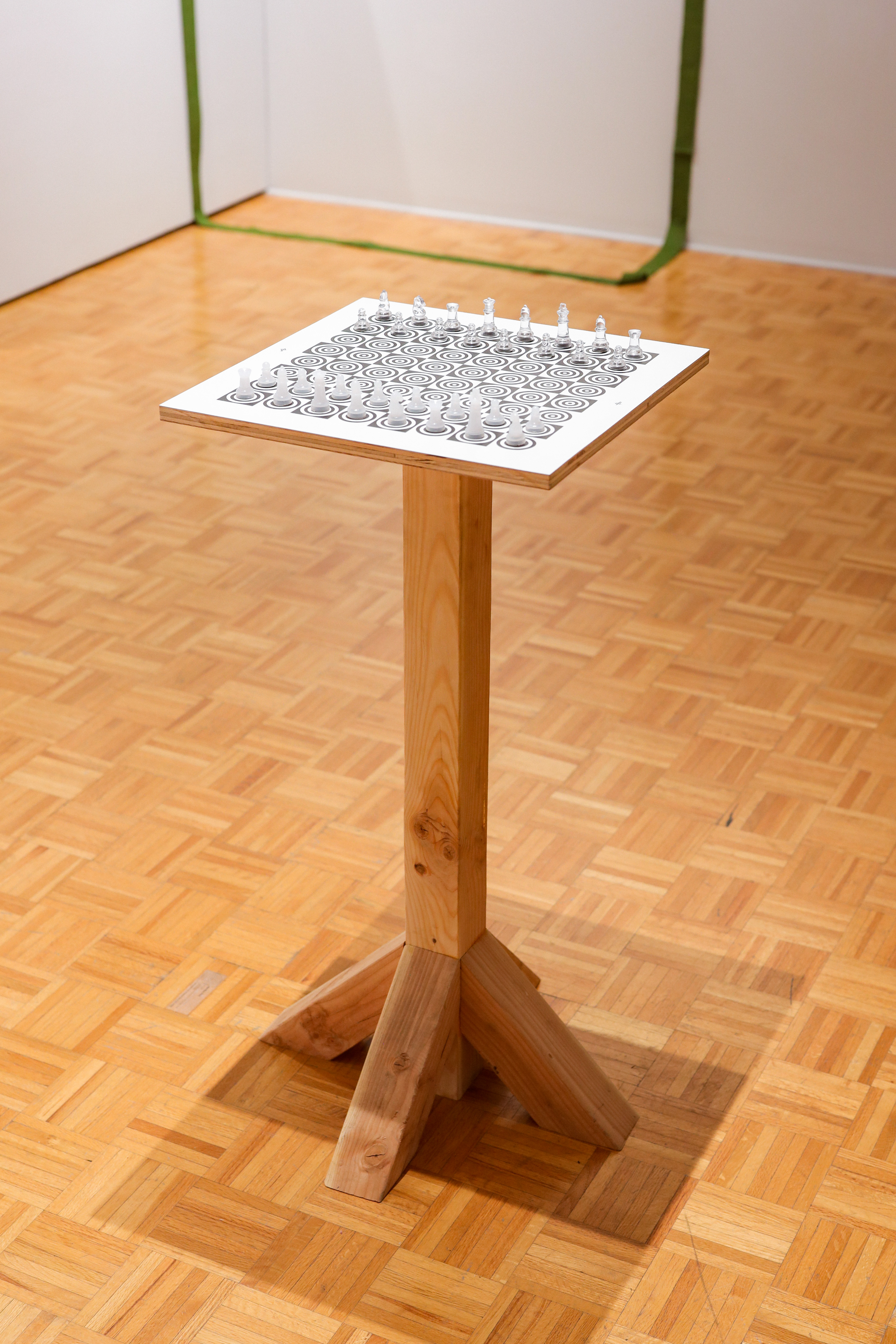 A screen printed chess board with targets on it titled, "Sacrifice"