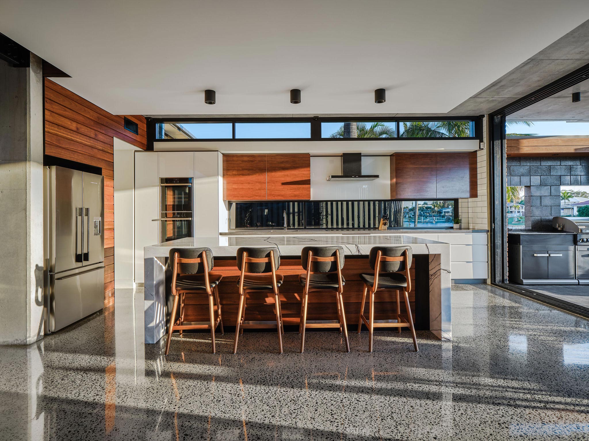 Kitchen and seating at Broadbeach Waters Residence, Gold Coast