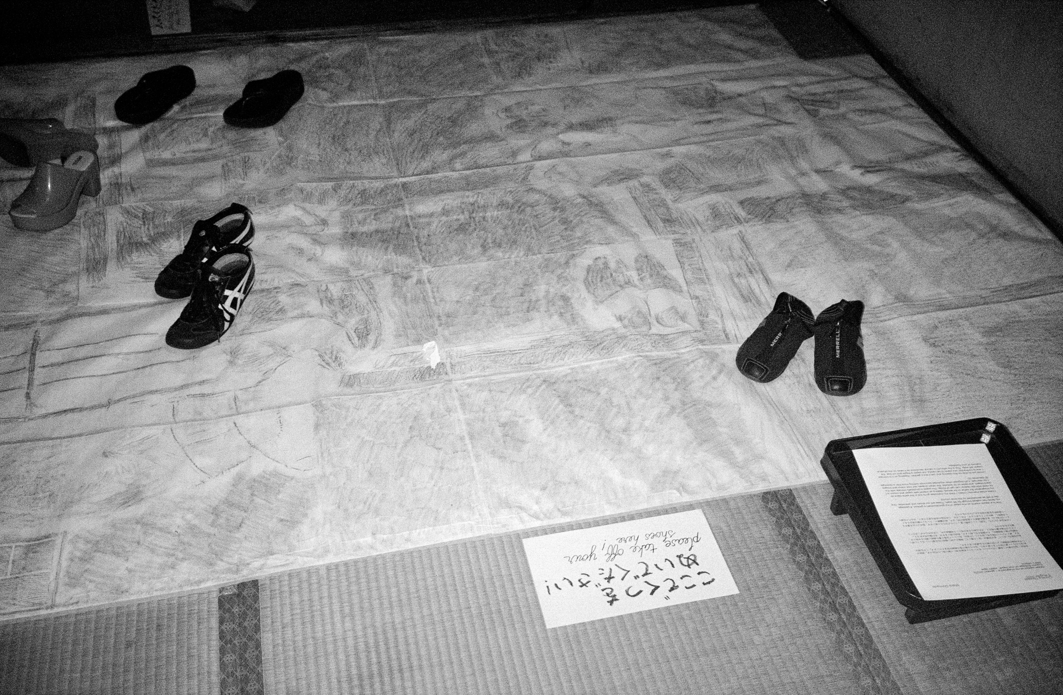 'Green replica of my imagination / genkan' installed in Tokyo with attendees shoes