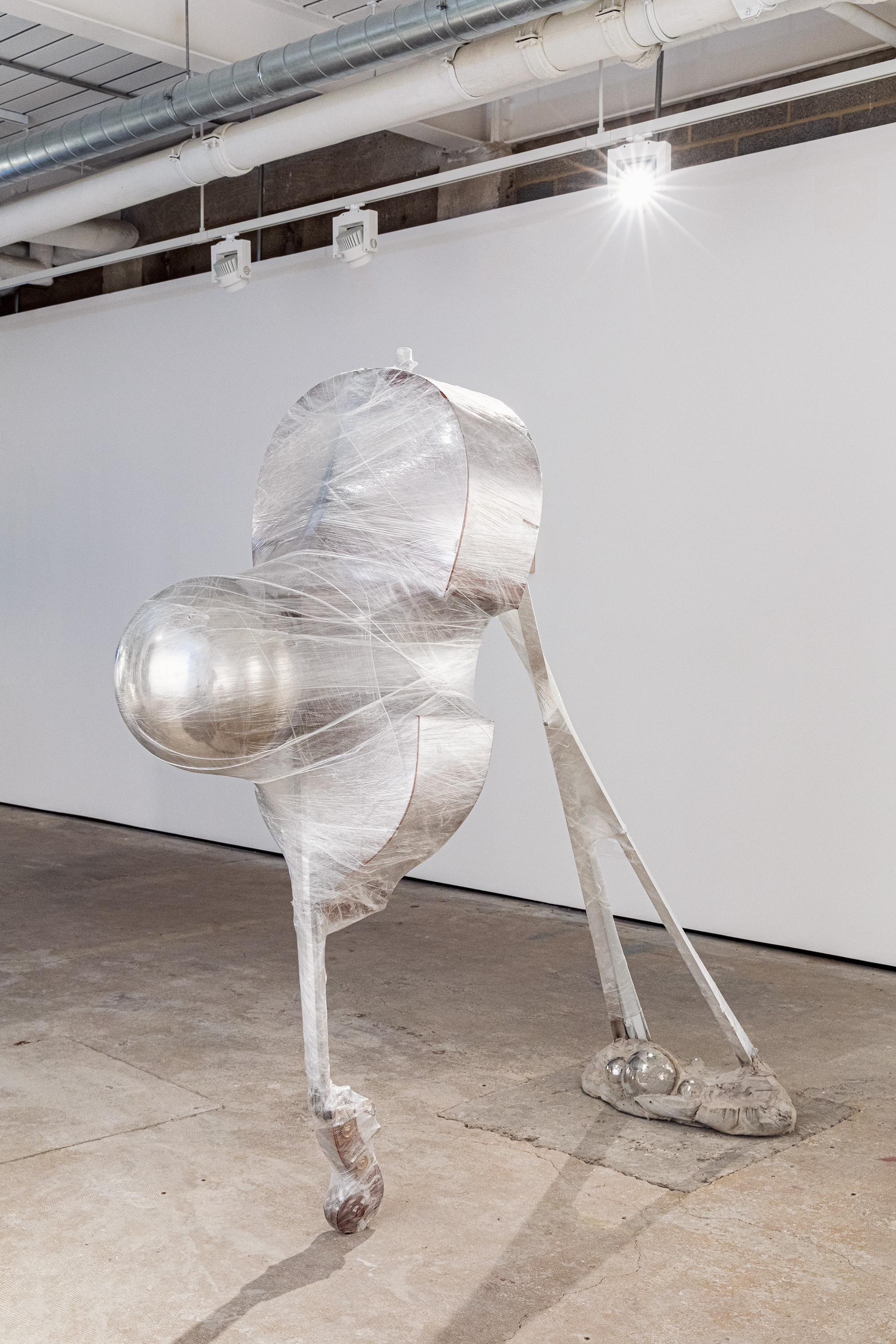 Auguste, 2023  (Double bass, Chrome-plated steel, Venetian blind, Aluminium, Cellophane, Spray paint, Concrete.) 183 x 173 x 63cm