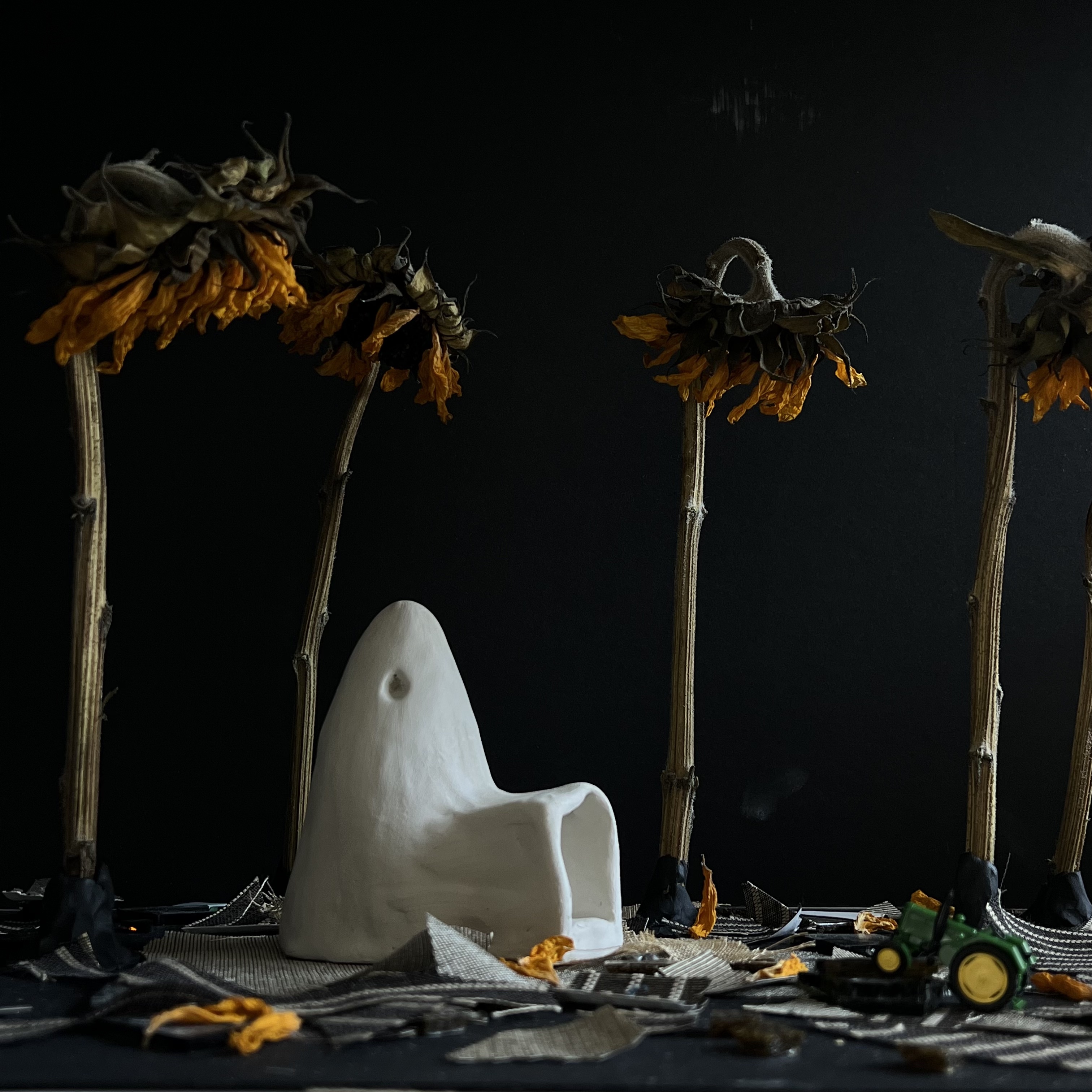 Fragile Refuge, 2022, clay, glass, dried sunflowers, and glass