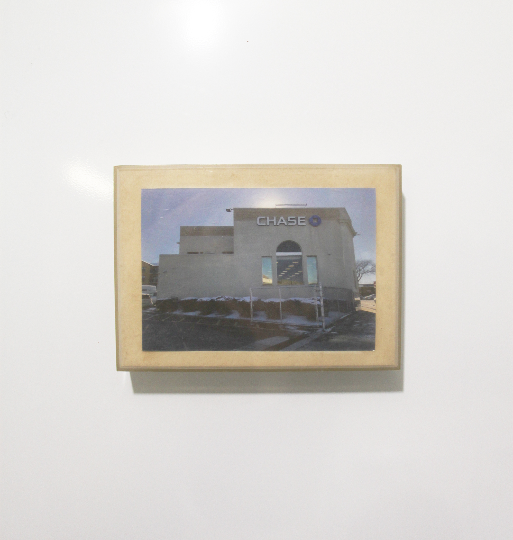 the sun rises over chase bank, 2025, 18.5cm x 13cm x 3.5cm, image, acrylic box frame 