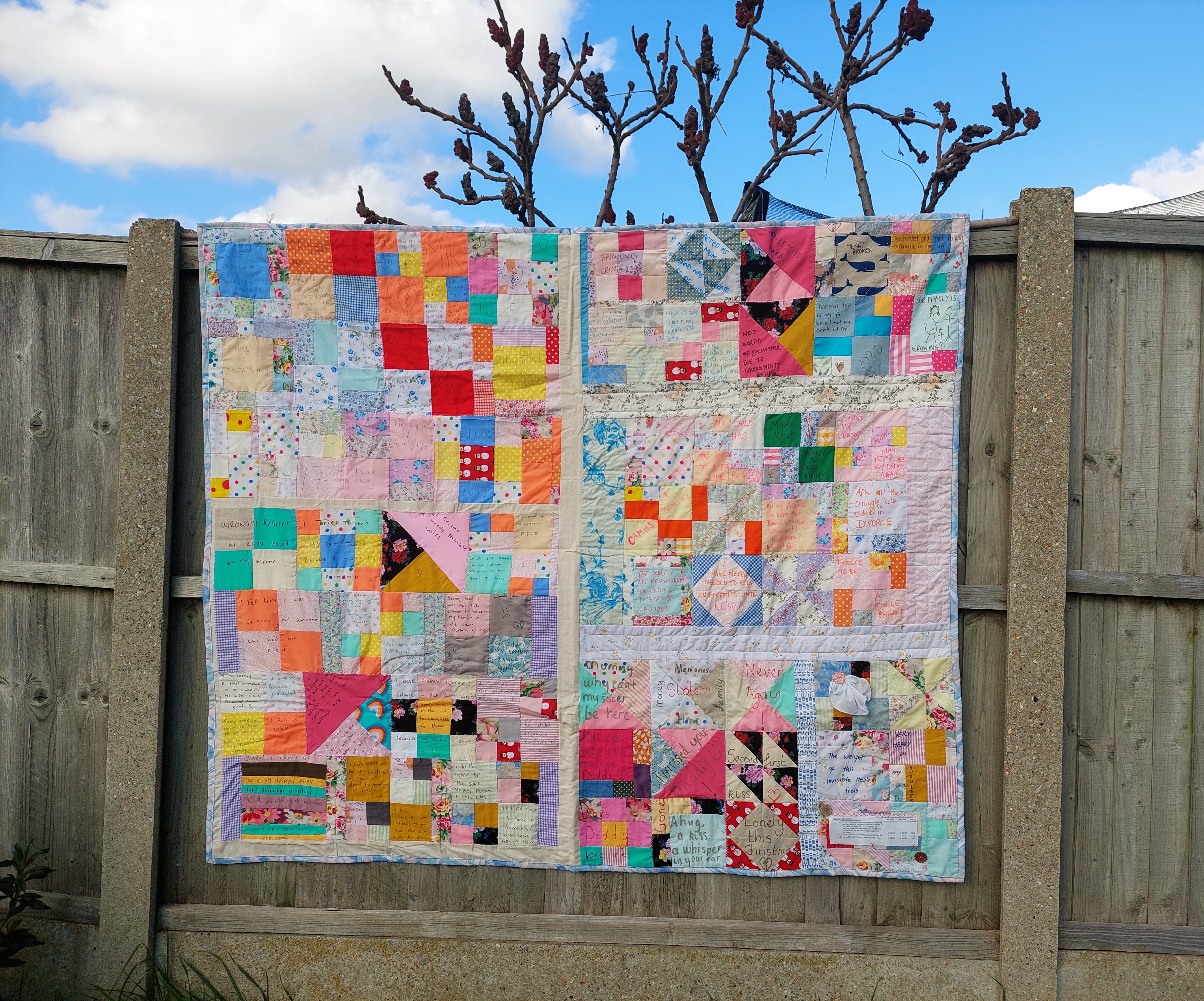 Caption: The “story panels” were then stitched together to form quilts. This is one of the three quilts.