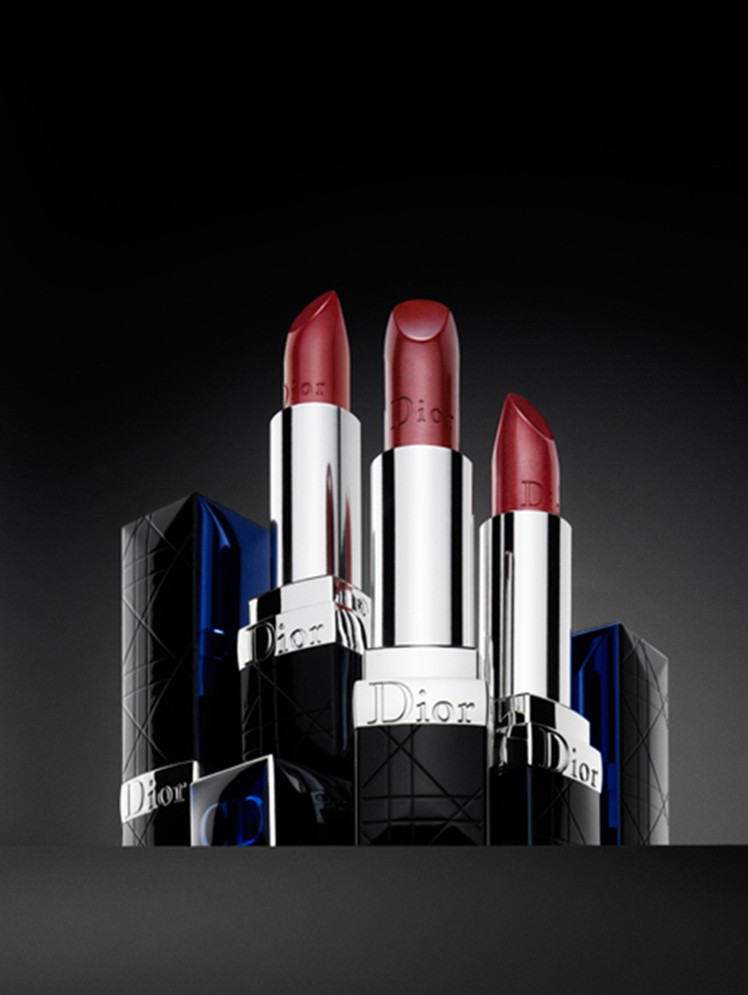 KMA stylist Sara Wacksman designs set for photo of dark red Dior lipstick standing up on black platform 
