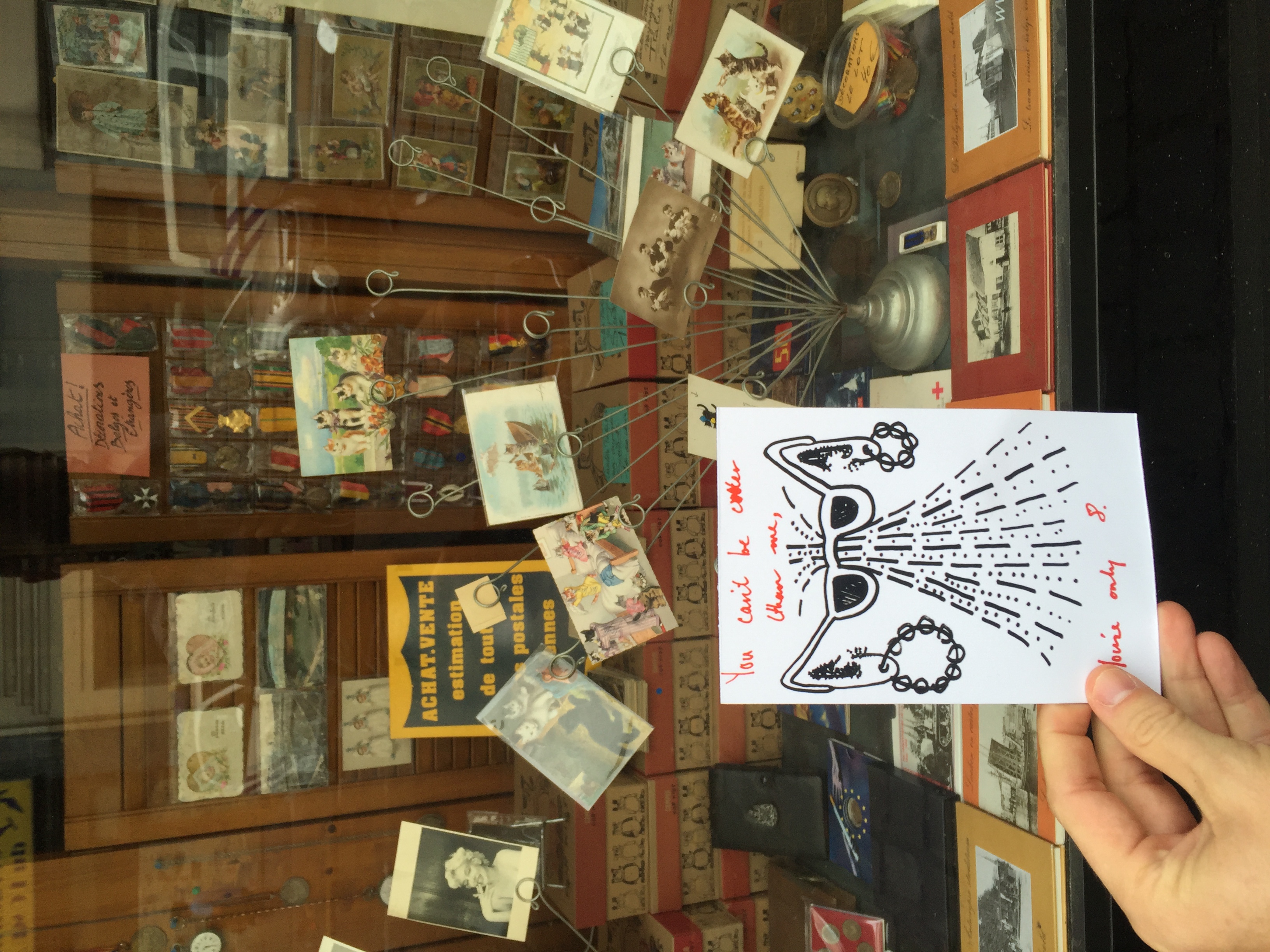 Molly Rodgeveller and I made this postcard as a kind of drawing game. The text says, "you can't be cooler than me, you're only 8." I left this card outside of an antique store selling postcards in the heart of Brussels. 