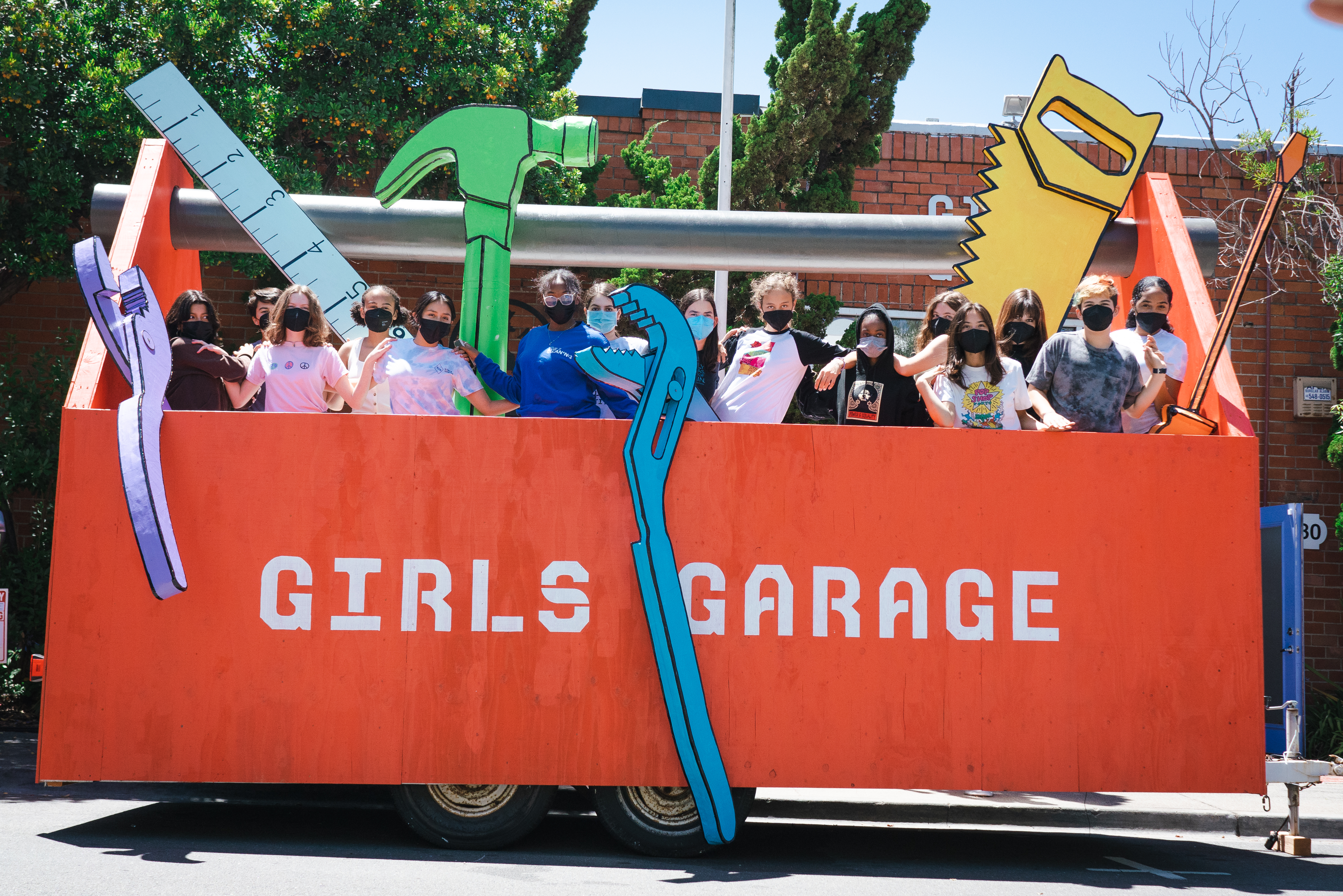 Girls Garage marches in the SF Pride Parade in a giant toolbox float they designed and built.