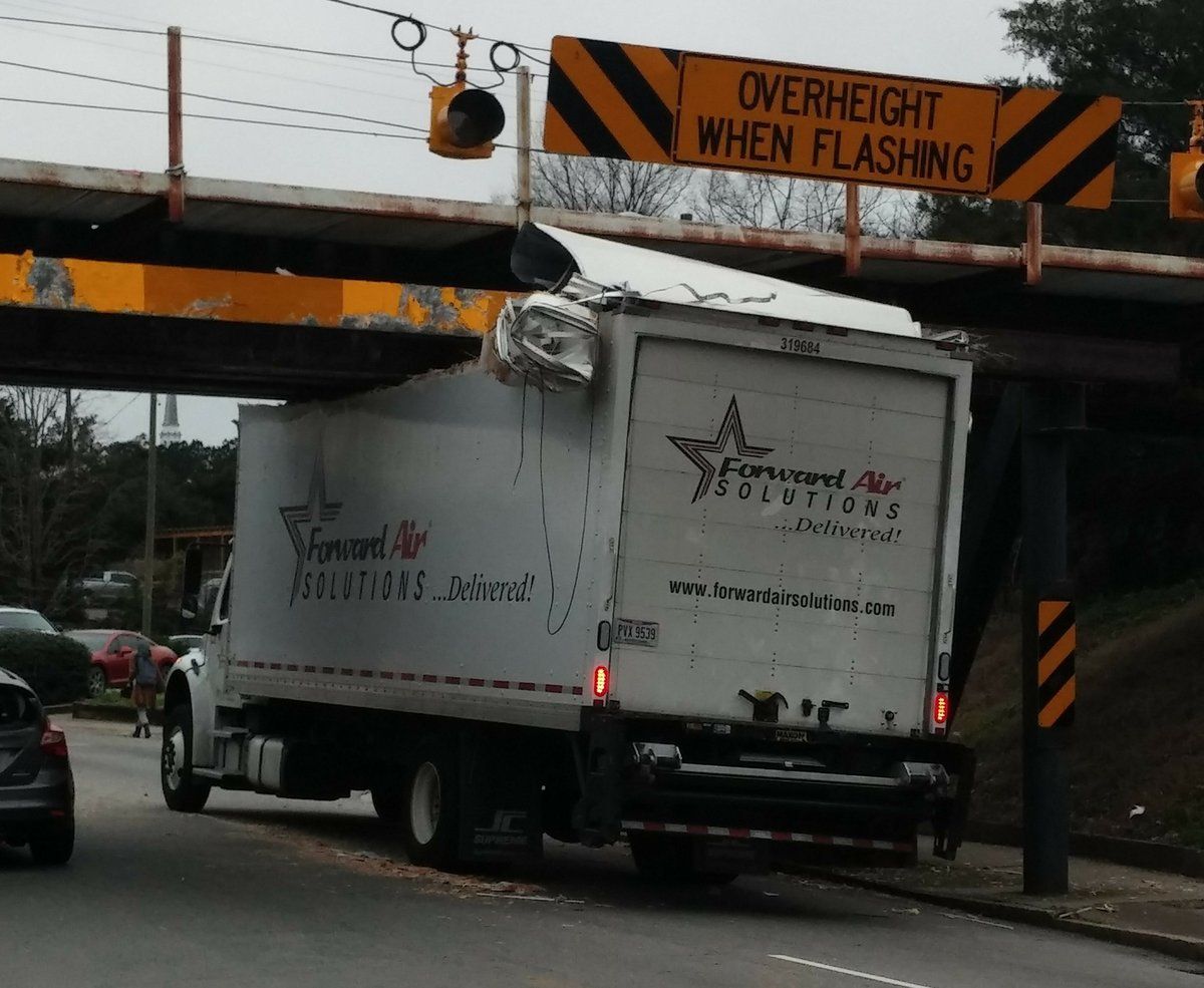 Can Opener Bridge; a bridge named so by the unfortunate effects of its height, almost but not permiting most standard height trucks to pass through, in turn uncovering their top as would a can opener. Mismeasurement in action.
