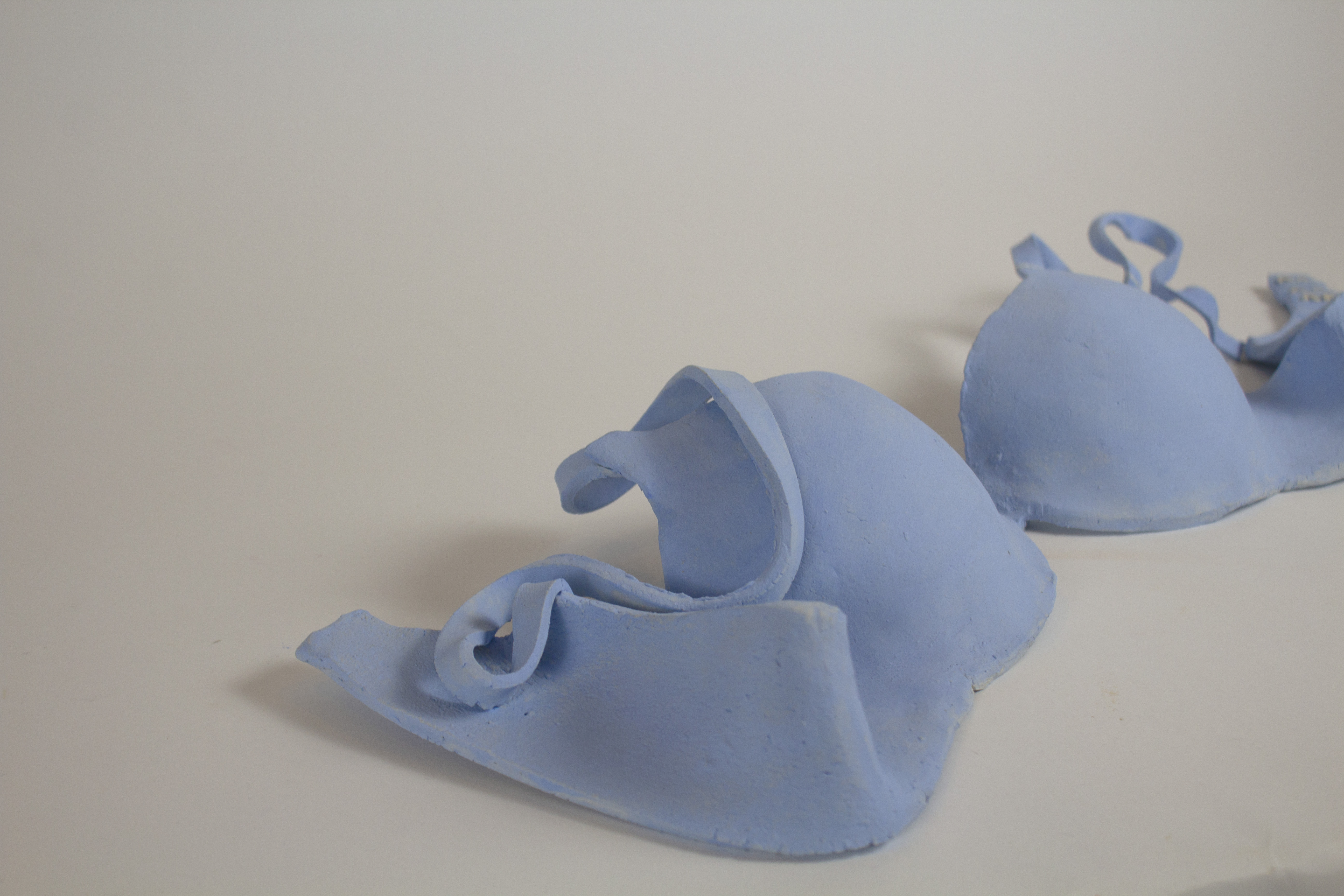 Bra (detail)Cone 6 White Ceramic and Underglaze, 4x23x5, 2023