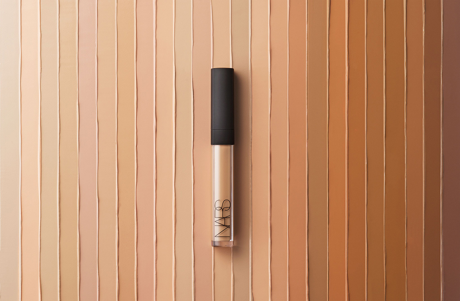 KMA stylist Rachel Haas designs set for photograph of foundation swatches in many different shades for NARS