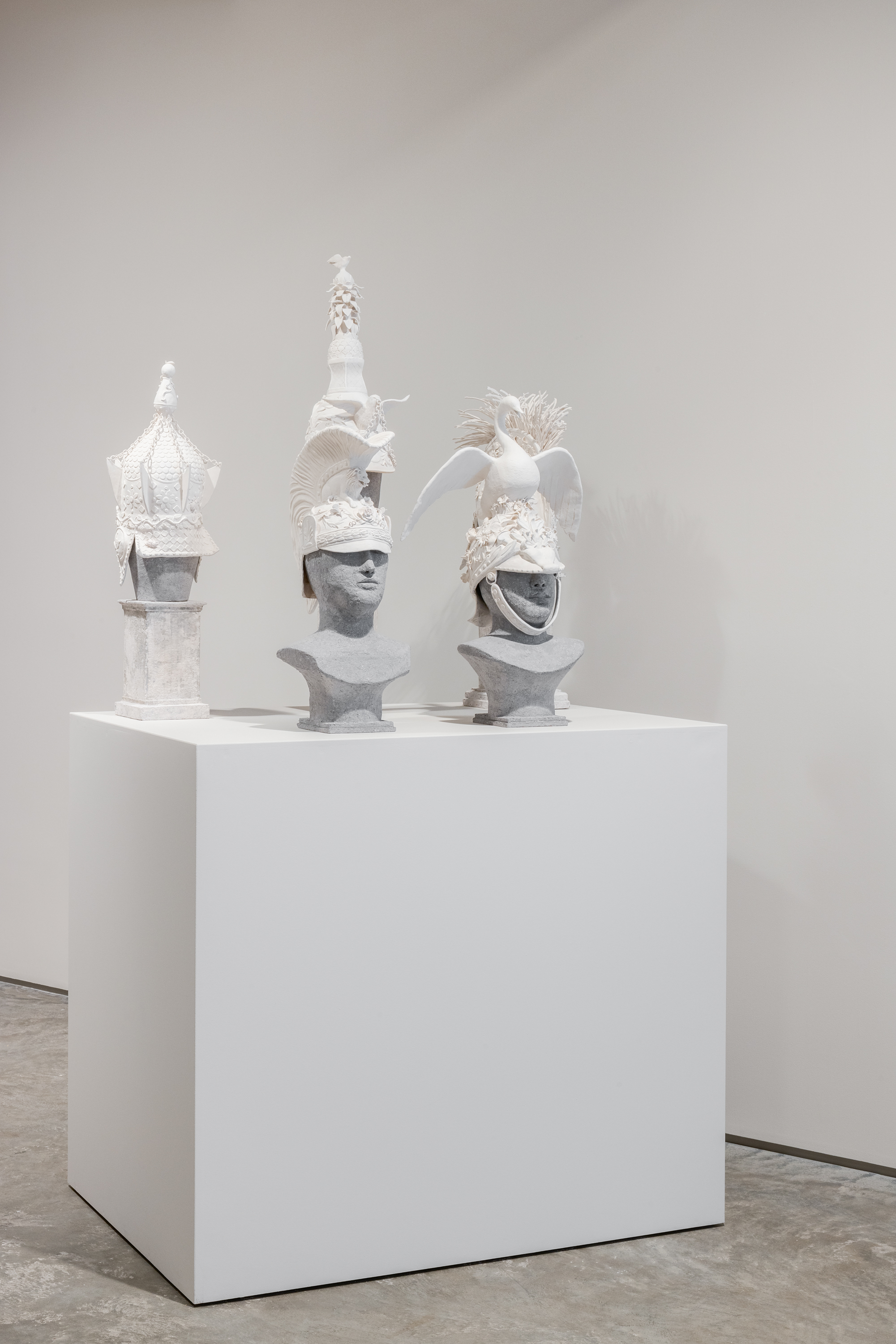 Susan Hamburger, &ldquo;Helmet I-V&rdquo;, 2022, White paper clay, Dimensions variable. Image by Rafael Gamo.