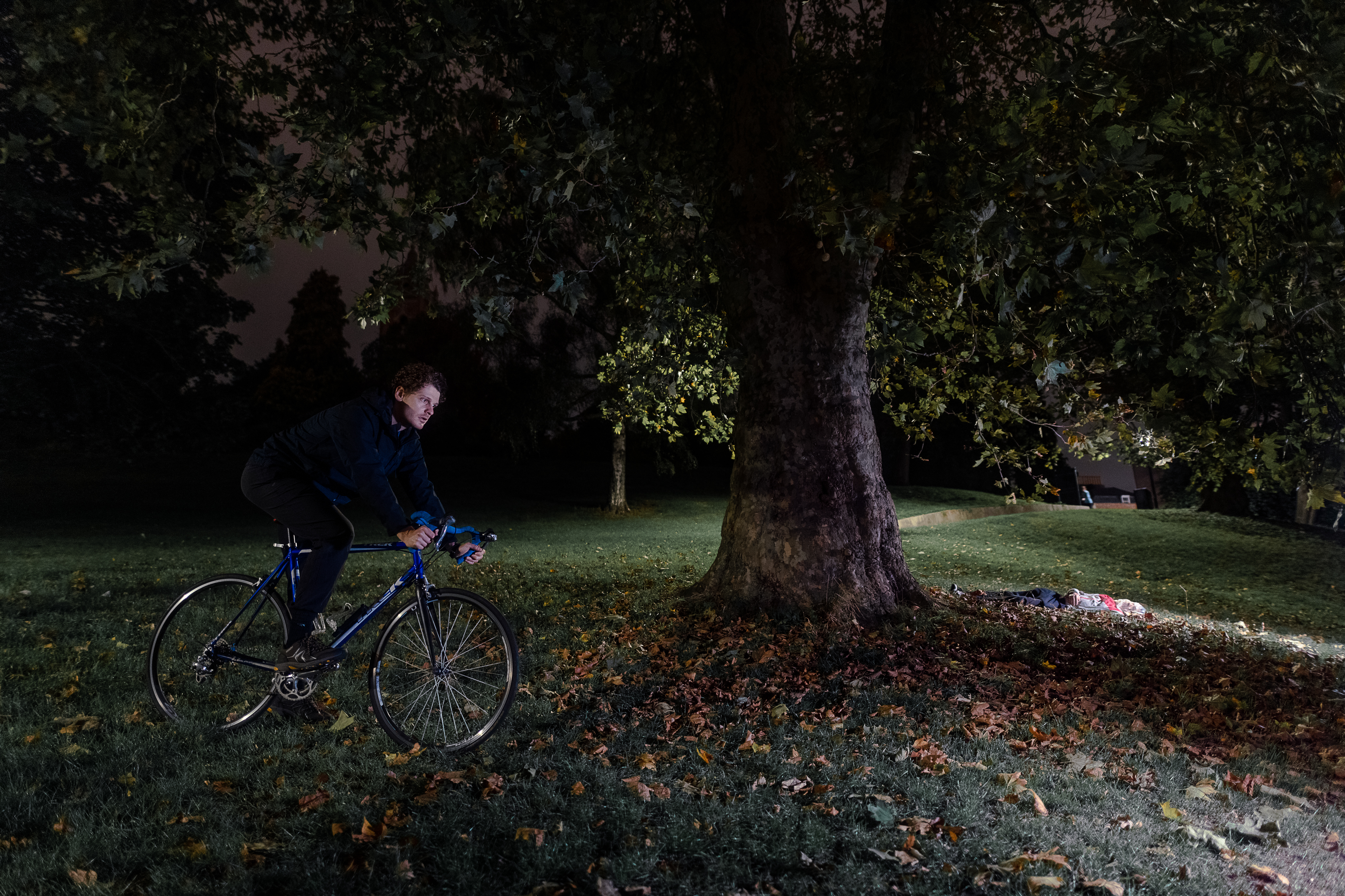Riding a bicycle in the park at night © Lai Po Kan 2022