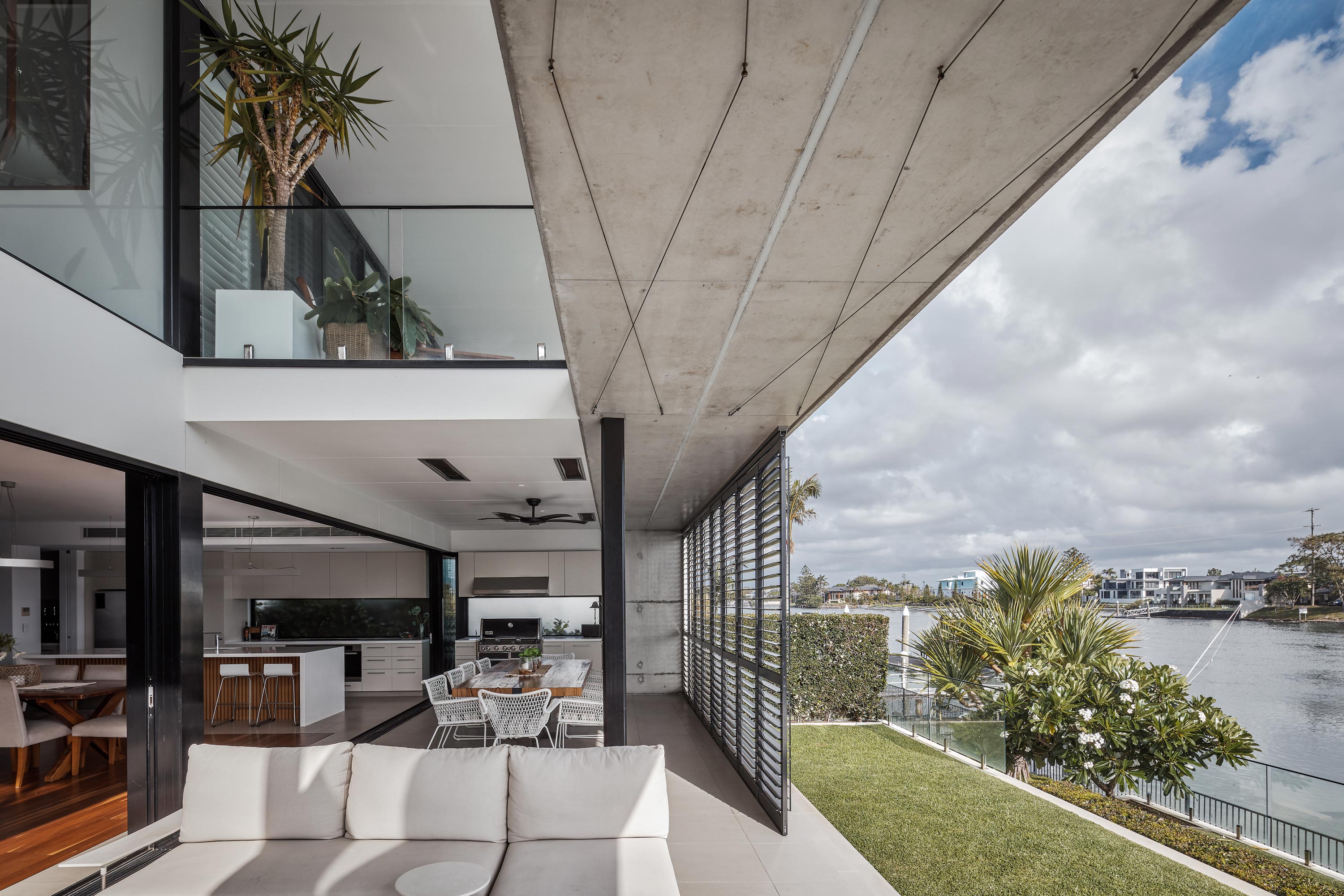 Outdoor living overlooking canal, resort-style home, Broadbeach Waters, Gold Coast, Queensland