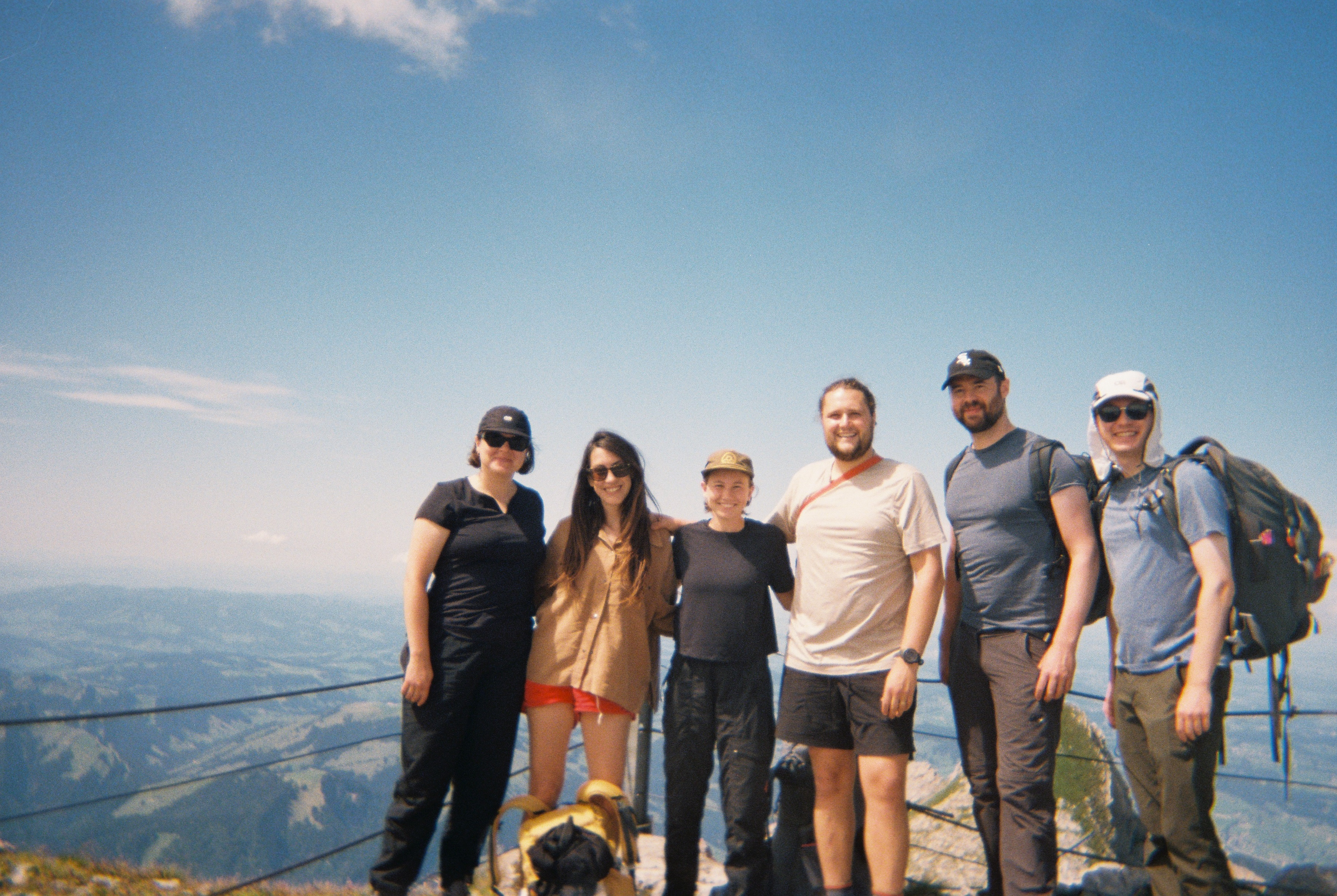 Members of the Institute for Linear Research on THE LINE on top of Säntis. Left to right: Mary, Matilde, Meg, Hudson, Luis and Drew. August 2024. 35 mm photo, Matilde Igual.