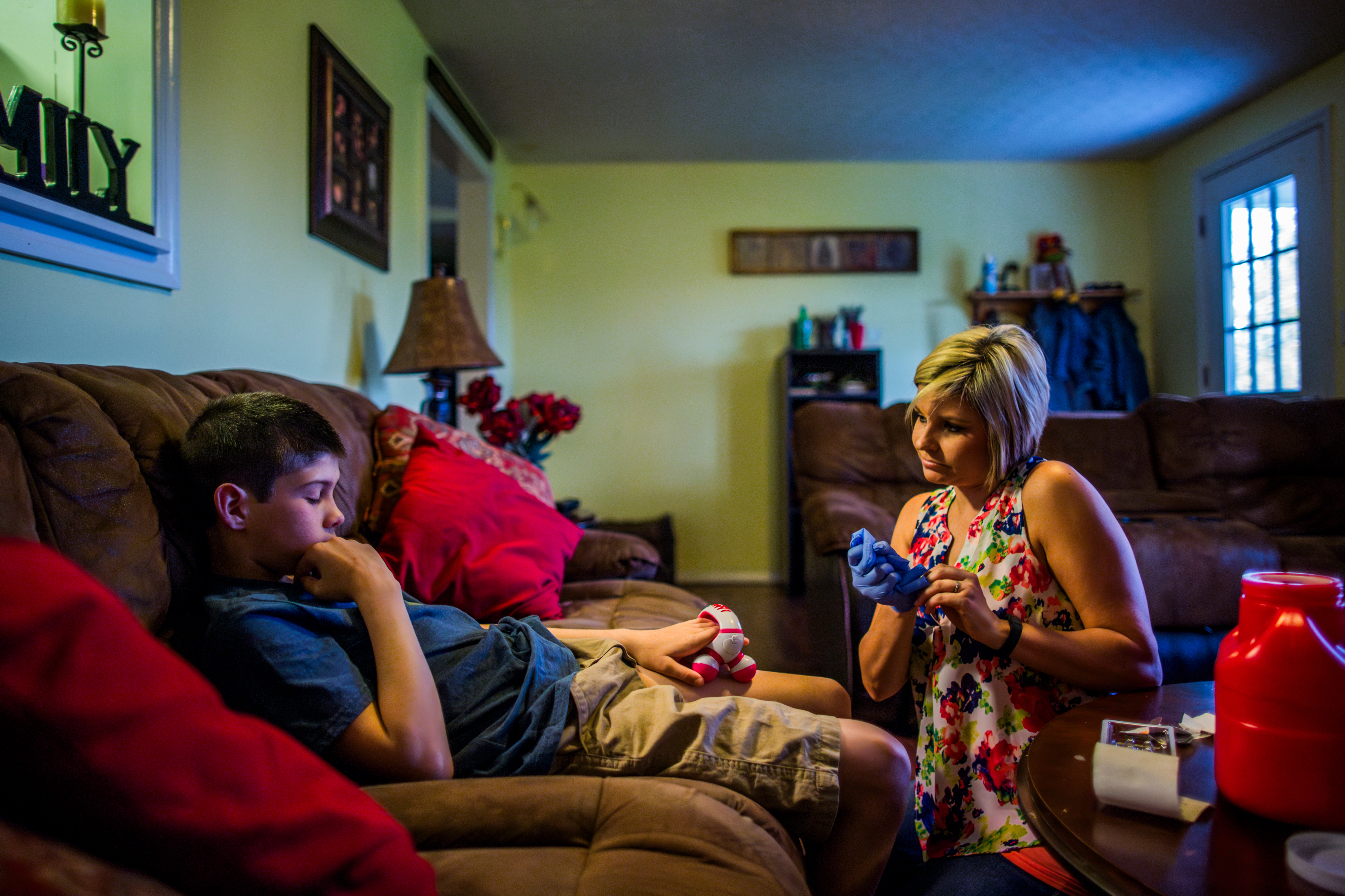 Leticia Hughes gives her son Ashton, 12, a dose of Humira for juvenile arthritis and Crohn’s disease. While her new job has a good drug-coverage plan, the medication is still more than the monthly rent. (The Wall Street Journal)