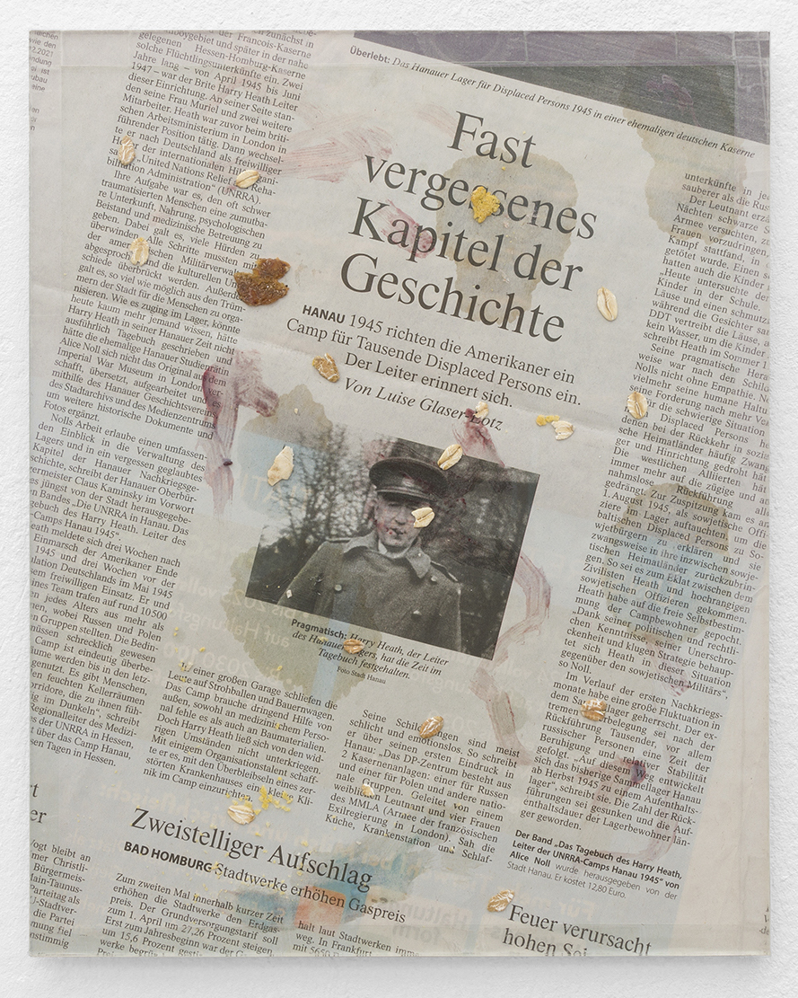 Ian Waelder – Here not today (Cigar Smoke), 2022. Leftovers of breakfast (strawberry jam, butter, cereals) on Frankfurter Allgemeine newspaper cut from February 2nd, 2022. Pressed with sheet of museum glass on wood. Framed with transparent tape. 24 x 30 cm.