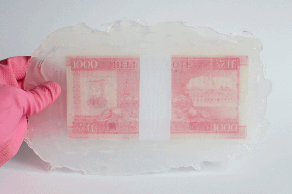 “Stack of Bills”. 2017, stack of paper bills and transparent silicone, 24 x 15 x 1 cm