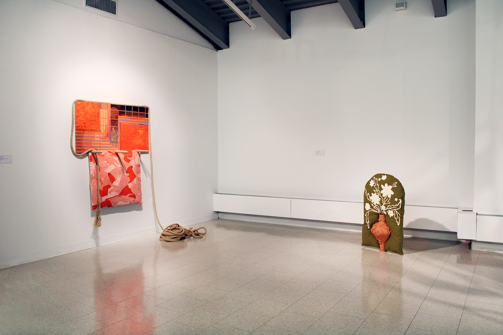 Left: painting by Hannah Parrett, Right: Green, 2022, upholstery fabric, leather, ceramic terra-cotta, 37x21x11in