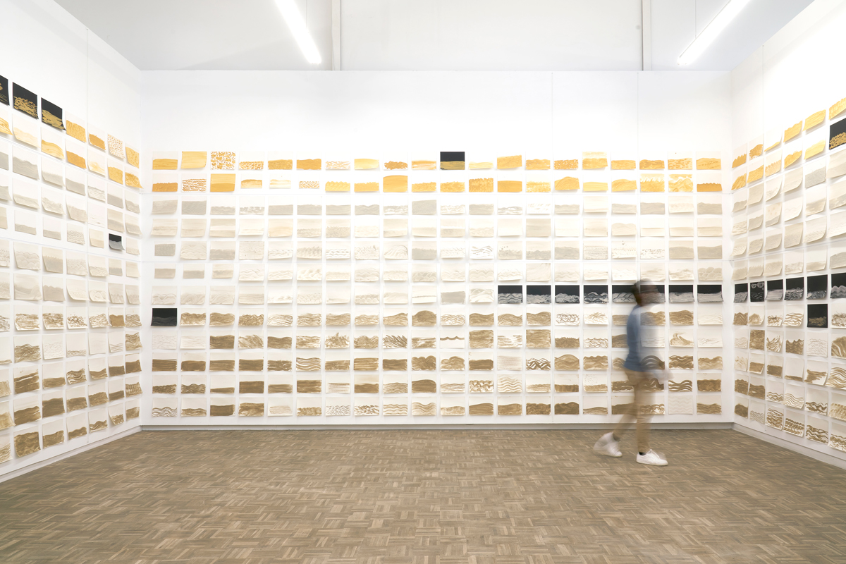 Dineo Seshee Bopape, Master Harmoniser (2021 - 2023) | approx. 960 drawings (handsourced soil from various locations and water on watercolour paper), wool installation, dimensions variable