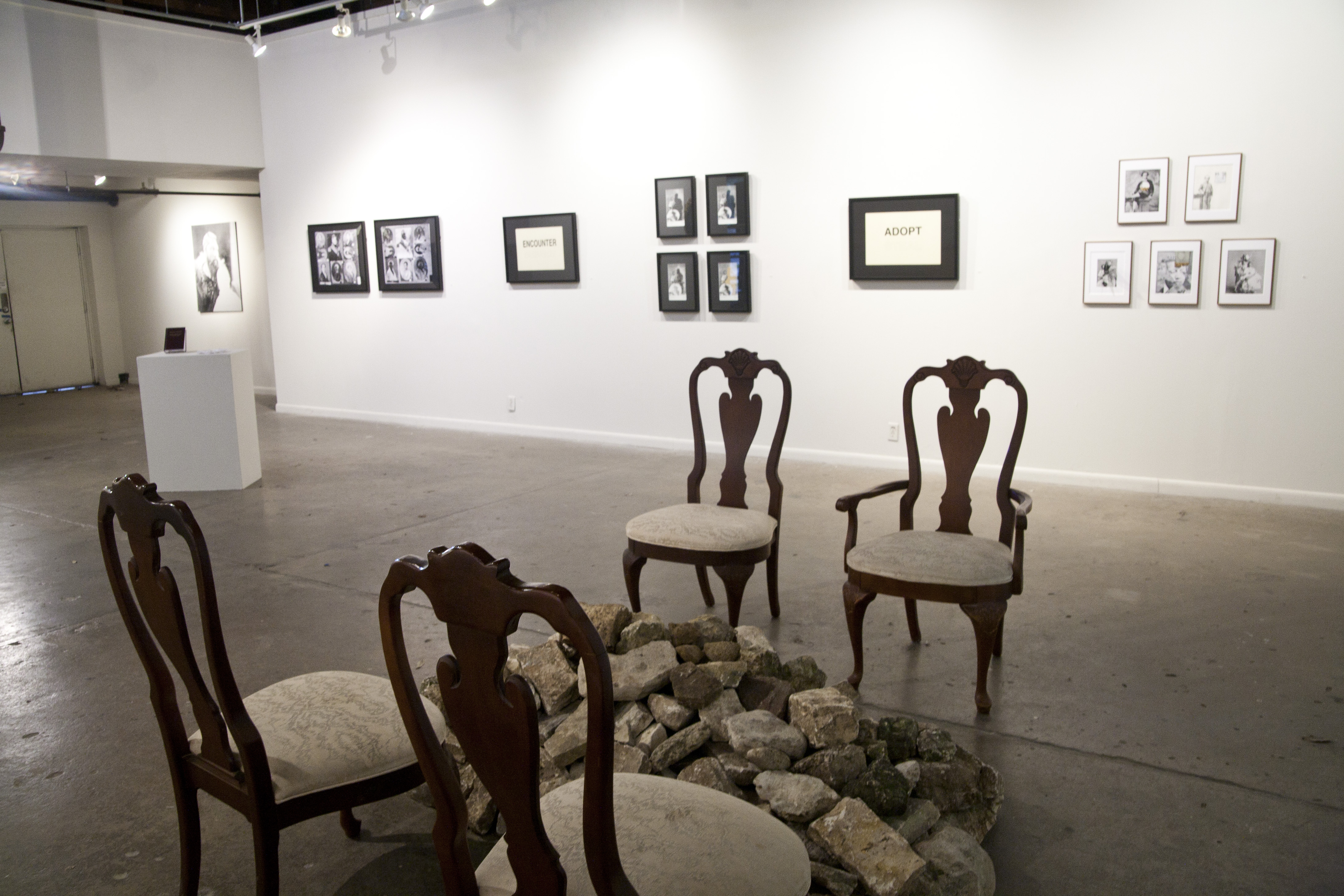 ፍታት for Alemayehu (fitat— "release",prayer for the deceased) in Queen Victoria's Private Sitting Room Buckingham Palace installations w/chairs, rocks, paper, appropriated photographs in frames and frankinsence 2016. Photo credit: Rebecca Marino