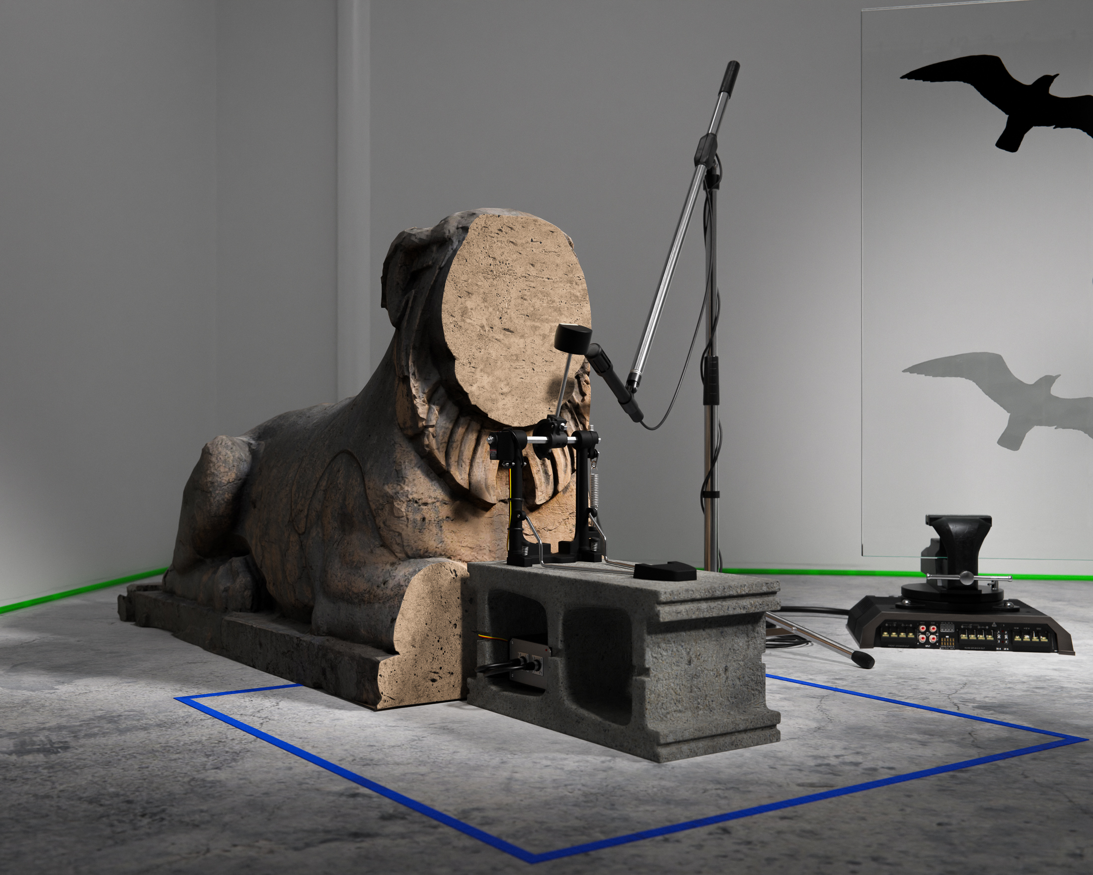 Beasts without number, 2022, defaced garden statue, cattle prod, transducer mic, kick drum pedal, servo motor, car amplifiers, cinderblock, vises, glass, anti-collision decals, arduino controllers, mics, mic stands, faux rock speakers, cables, tape, dimensions variable