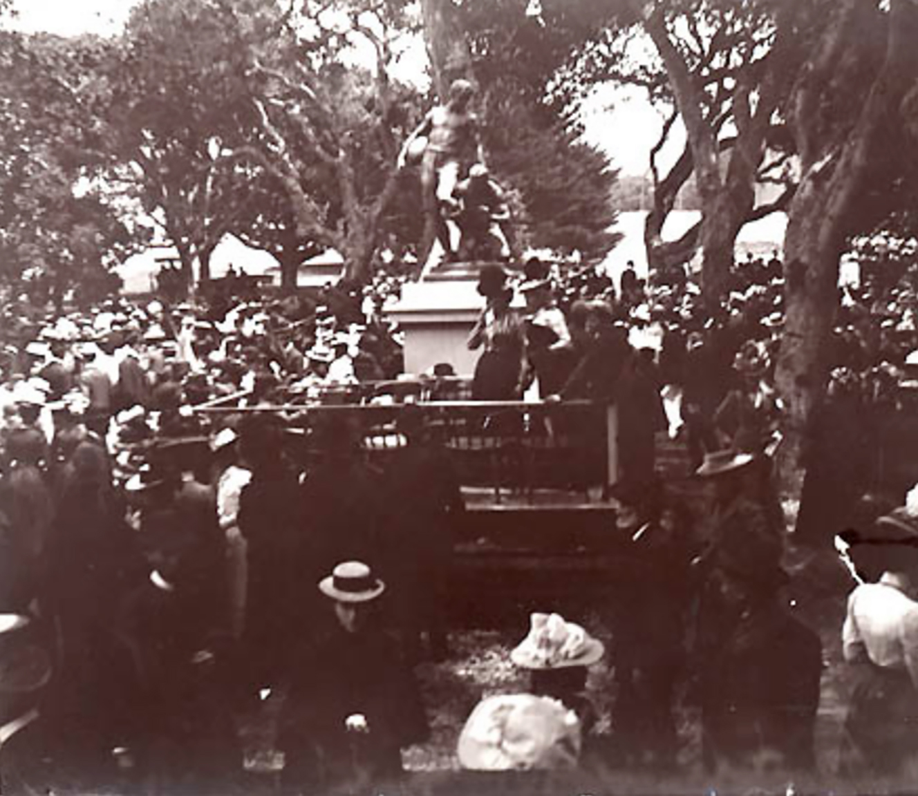 Dedication ceremony of The Football Players, 12 May 1900 on the UC Berkeley campus, between Strawberry Creek and the Valley Life Sciences building. Photograph from Douglas Tilden, Papers, BANC MSS 89/124 c, The Bancroft Library, University of California, Berkeley.