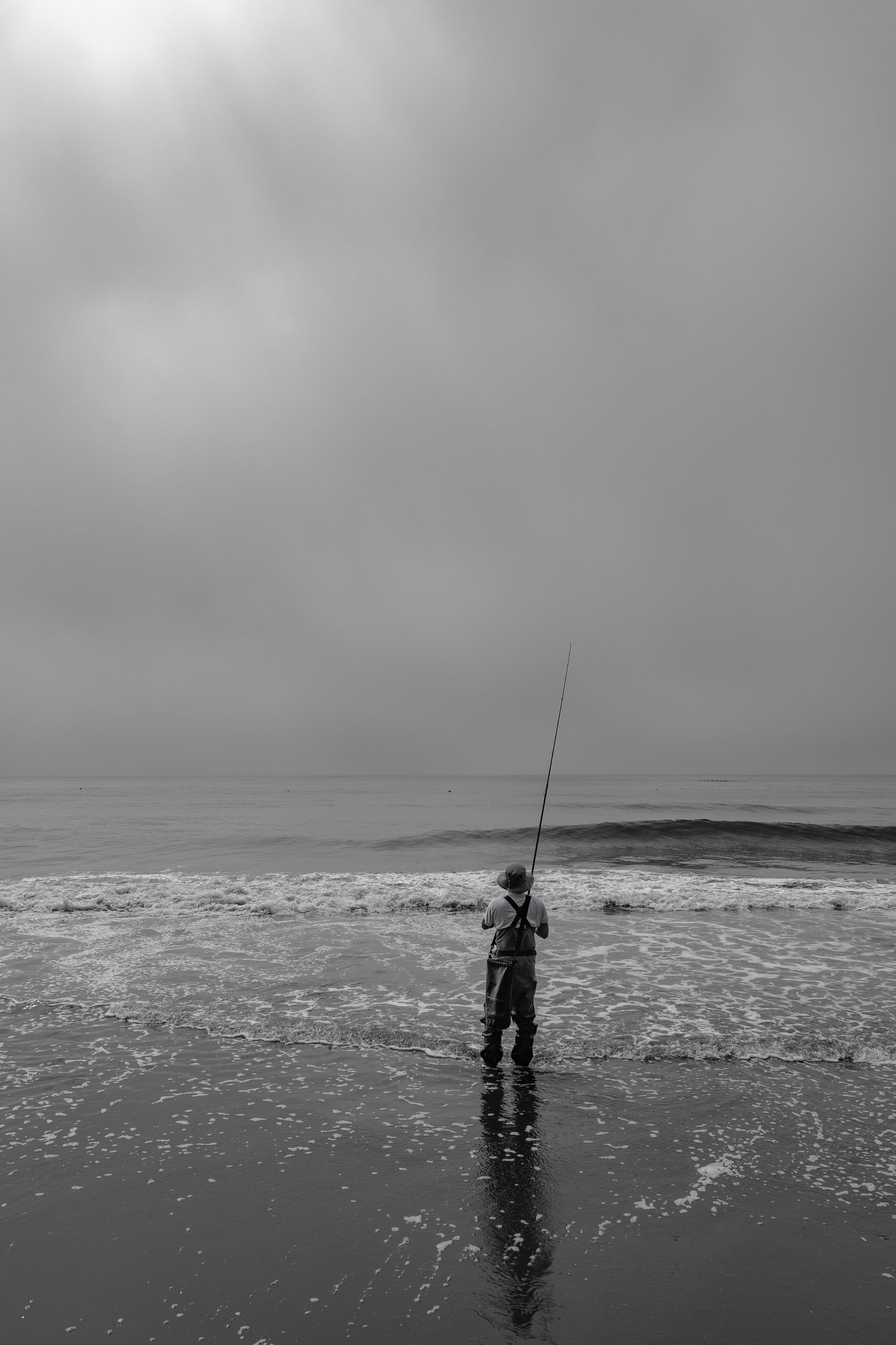Pêcheur, plage Pacifique