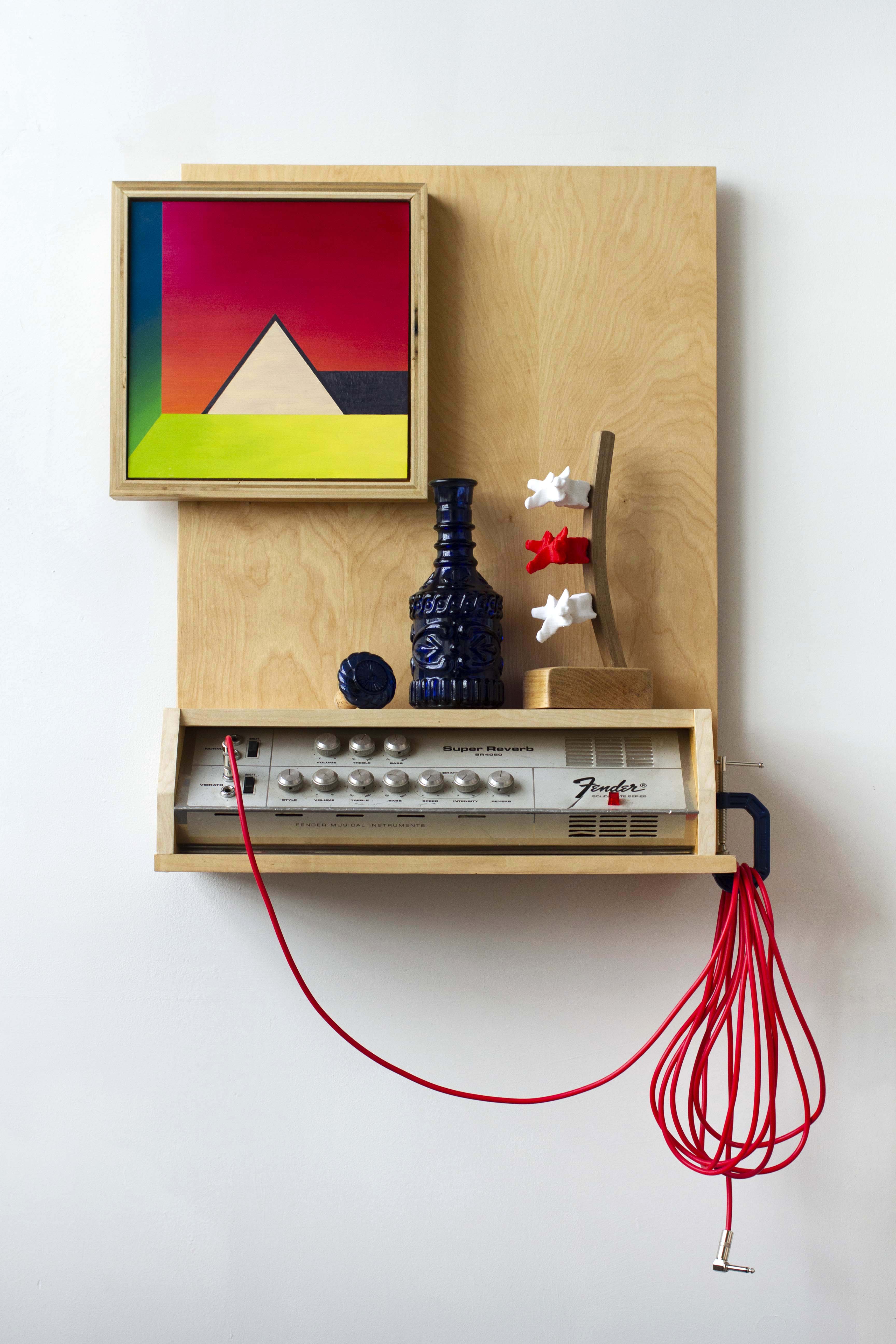 A Sort of Expansion of Being That Life Curbs and Caution Arrests, 2020, 28" x 24" x 8". Oil on panel, wood, PLA, glass decanter, amplifier faceplate, electrical components, clamp, cable, polyurethane